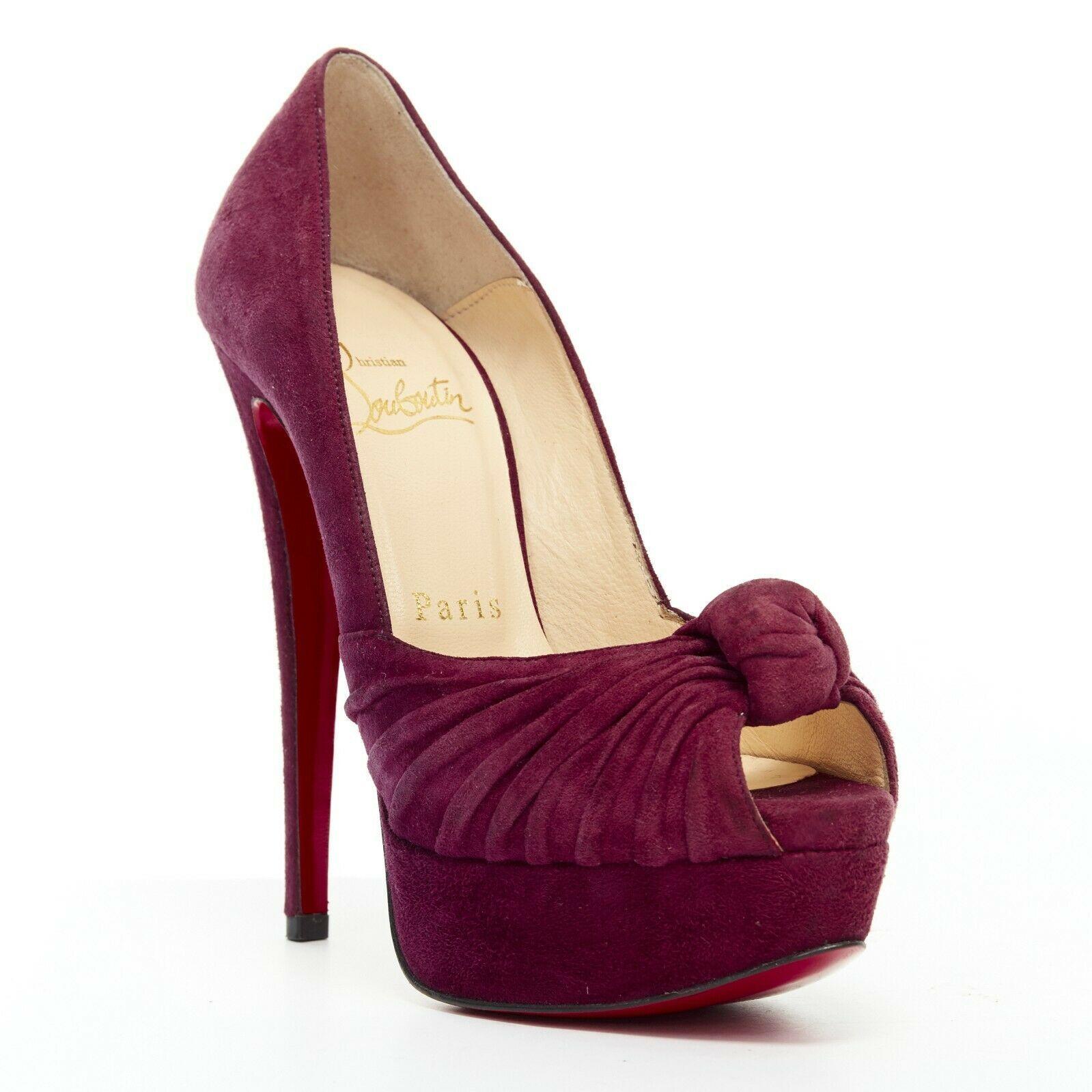 CHRISTIAN LOUBOUTIN Jenny 150 purple suede knot peep toe platform pump EU35.5

CHRISTIAN LOUBOUTIN
Jenny 150. Purple suede leather upper. Knot detail at front. Draped detail at front strap. Peep toe. Platform sole. Padded tan leather lining.