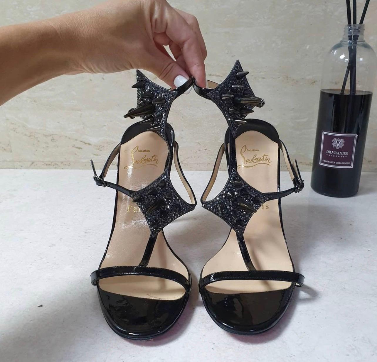 Kick other strappy sandals aside and set your sights on this Christian Louboutin sandal, evocatively adorned with sharp spikes.

Patent calfskin strappy sandal with spike and pave crystal adornments.

Condition is never worn.

No box. No dust