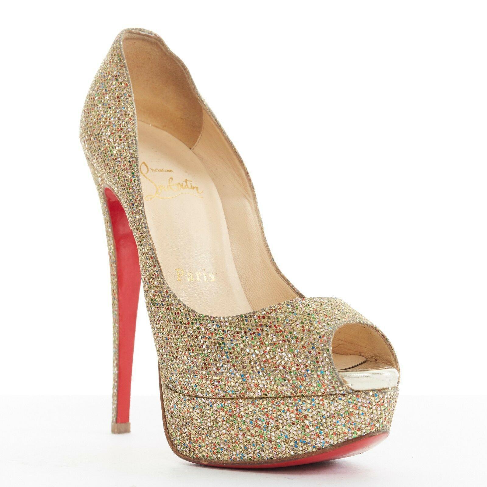 CHRISTIAN LOUBOUTIN Lady Peep 150 gold glitter peep toe platform heels EU36 US6

CHRISTIAN LOUBOUTIN
Lady Peep 150. Gold glittery fabric upper. Peep toe. Platform sole. Metallic gold leather lining at peep toe. Slim high heel. Signature red
