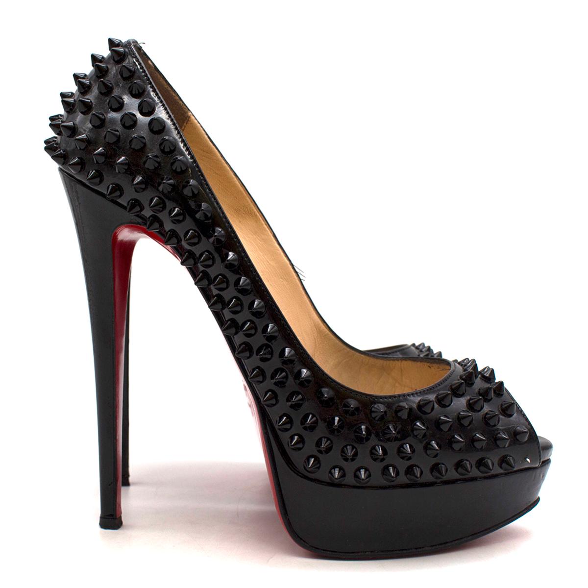 Christian Louboutin Lady Peep Spikes 145mm leather pumps

- Black, patent leather
- Peep toe, leather-covered platform and high stiletto heel 
- Black spike embellished
- Nude leather lining and insole 
- Signature red leather sole
- Comes with a