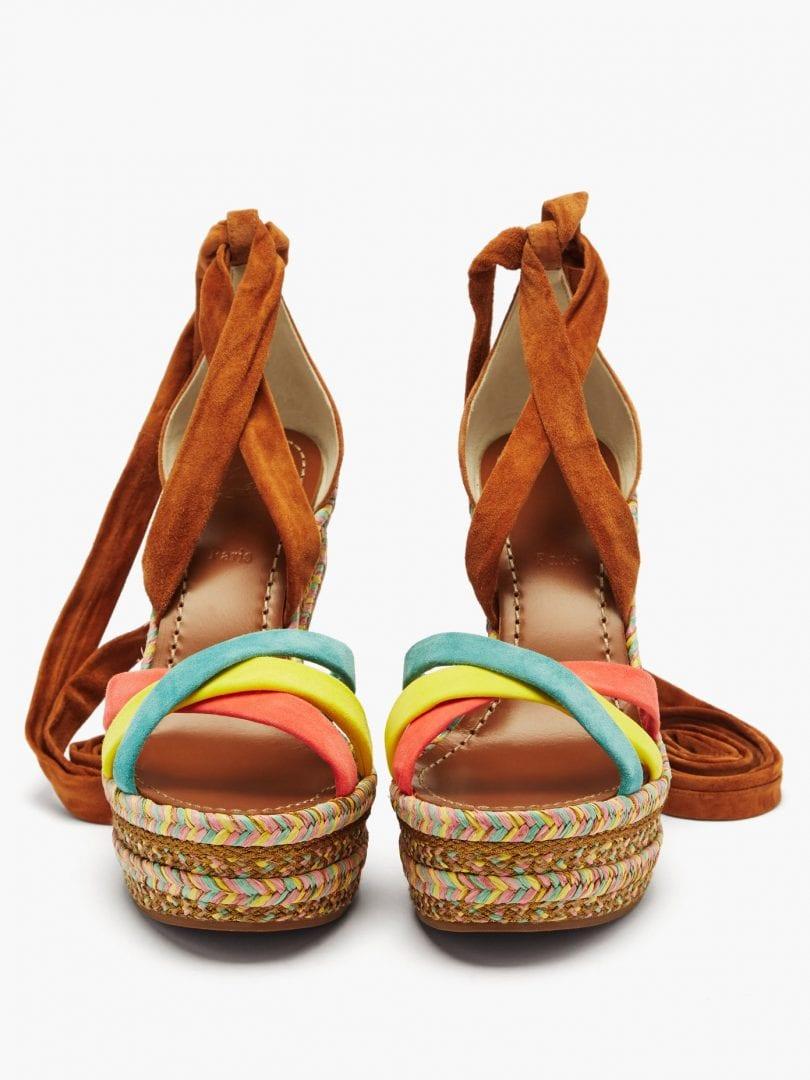 Christian Louboutin's tan Lagoadonna sandals are accented with artfully woven braided trims, evoking an uplifting mood. They're made in Italy from soft suede with wraparound ankle ties and pastel-hued crossover straps in turquoise, yellow and