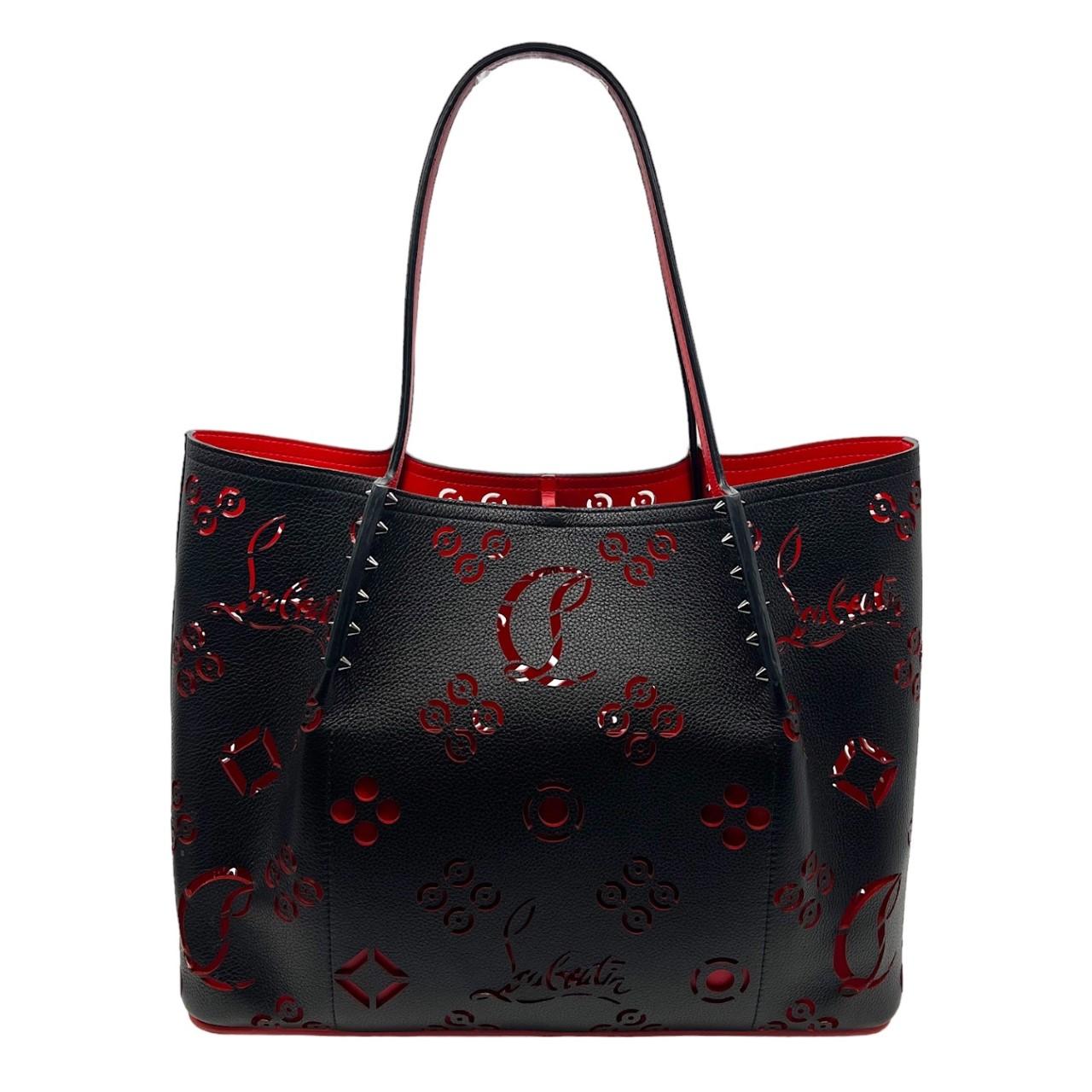 We are offering this very beautiful Christian Louboutin Cabarock Loubinthesky large tote. Made in Italy, it is finely crafted of black leather that is detailed with Loubinthesky-shaped perforated cut out designs and silver-tone spiked studs. It has