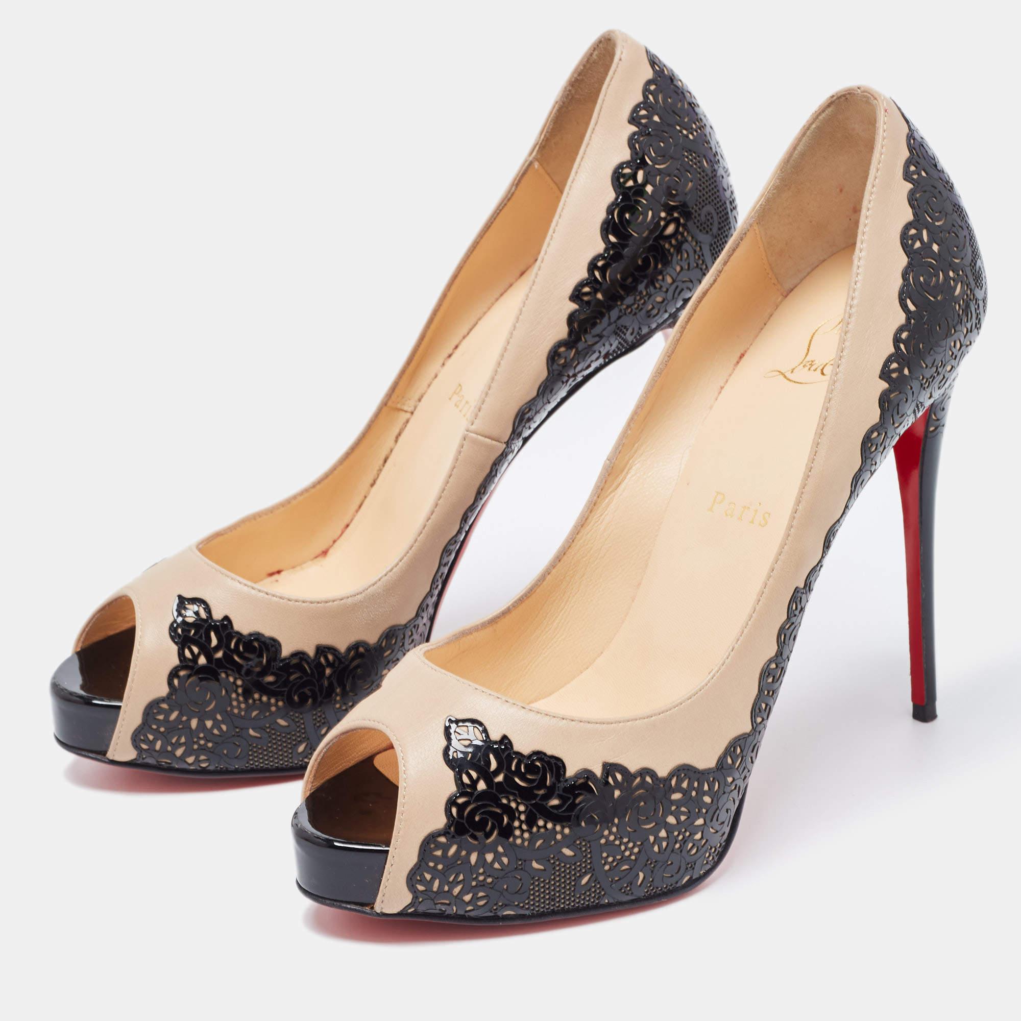 This gorgeous pair of Louboutins exudes high fashion with class. Crafted from two tone patent leather these Veramucha pumps feature peep toes and a laser cut lace exterior. Completed with leather lined insoles and stiletto heels these pumps will be