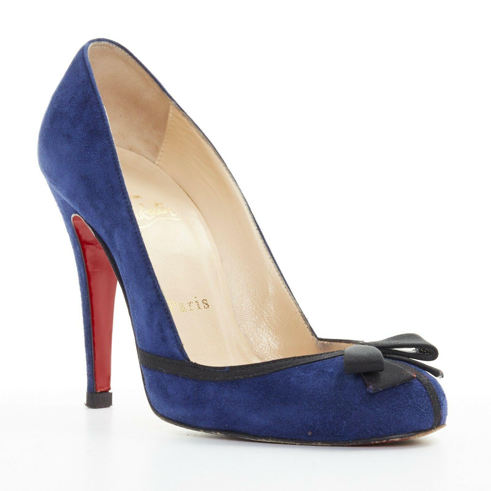 CHRISTIAN LOUBOUTIN Lavalliere 100 blue suede bow detail round toe pump EU36.5

CHRISTIAN LOUBOUTIN
Lavalliere 100. Dark blue suedeleather upper. Ribbon bow detail at toe. Round toe. Tonal stitching. Padded tan leather lining. Signature Christian