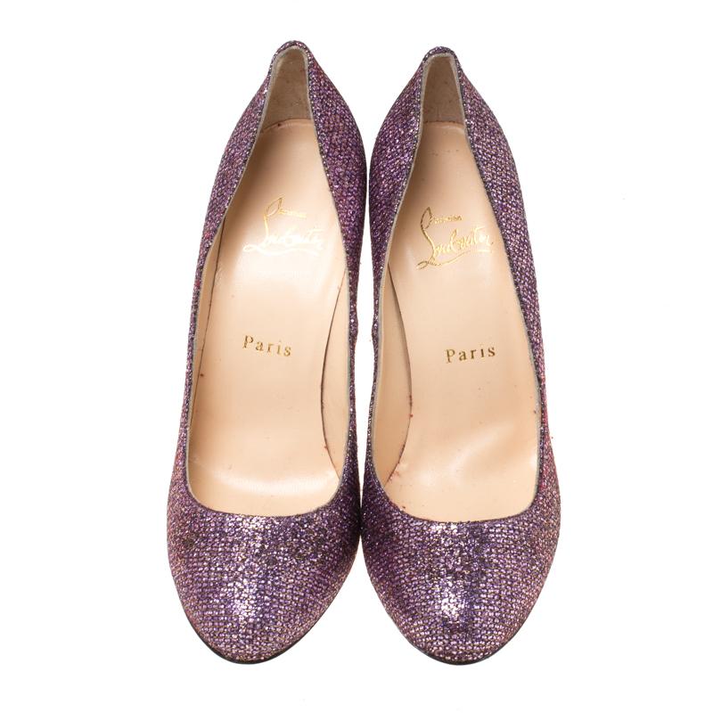 Feel glamorous every time you slip into this glitzy pair by Christian Louboutin. Covered in lavender glitter and balanced on 11 cm heels, these pumps will be a winner with all your well-tailored outfits. They are finished with the signature red on
