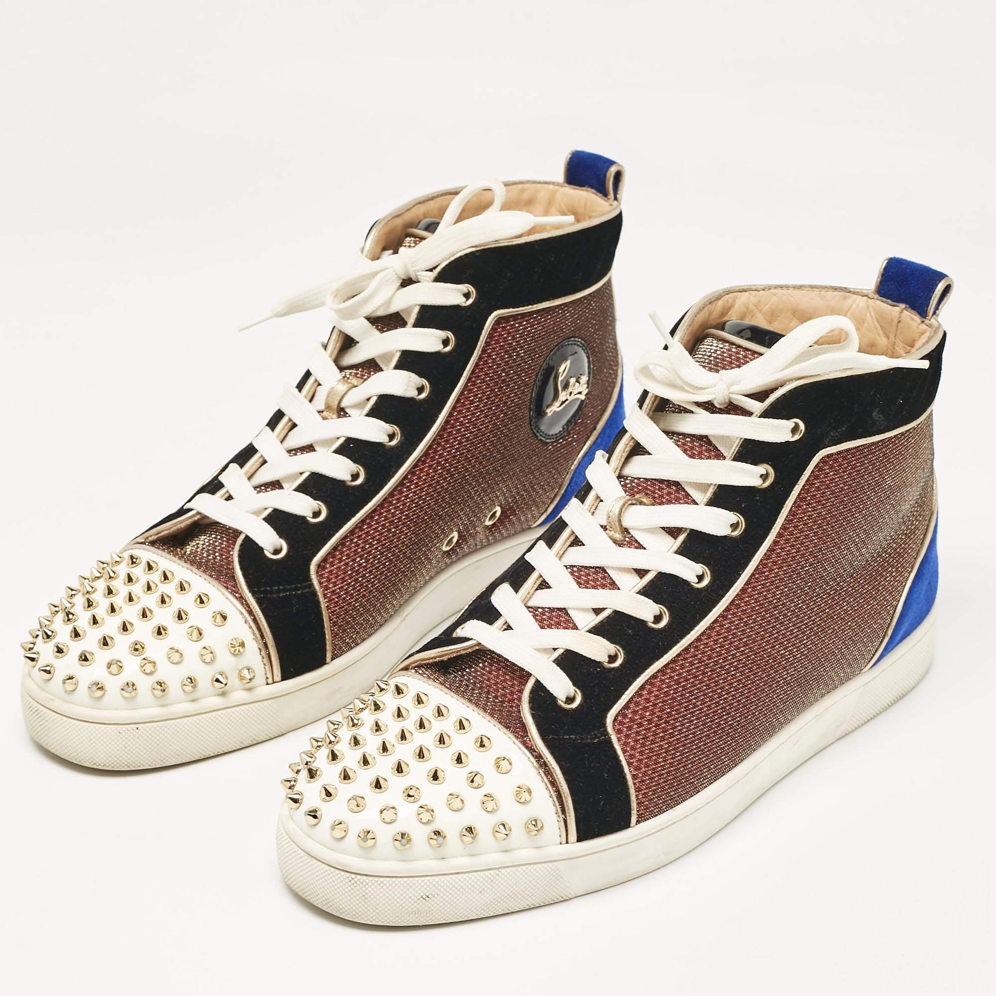 Add a statement appeal to your outfit with these Christian Louboutin sneakers. Made from leather and suede  they feature lace up vamps  stud spikes  and relaxing footbeds. The rubber sole of this pair aims to provide you with everyday ease.