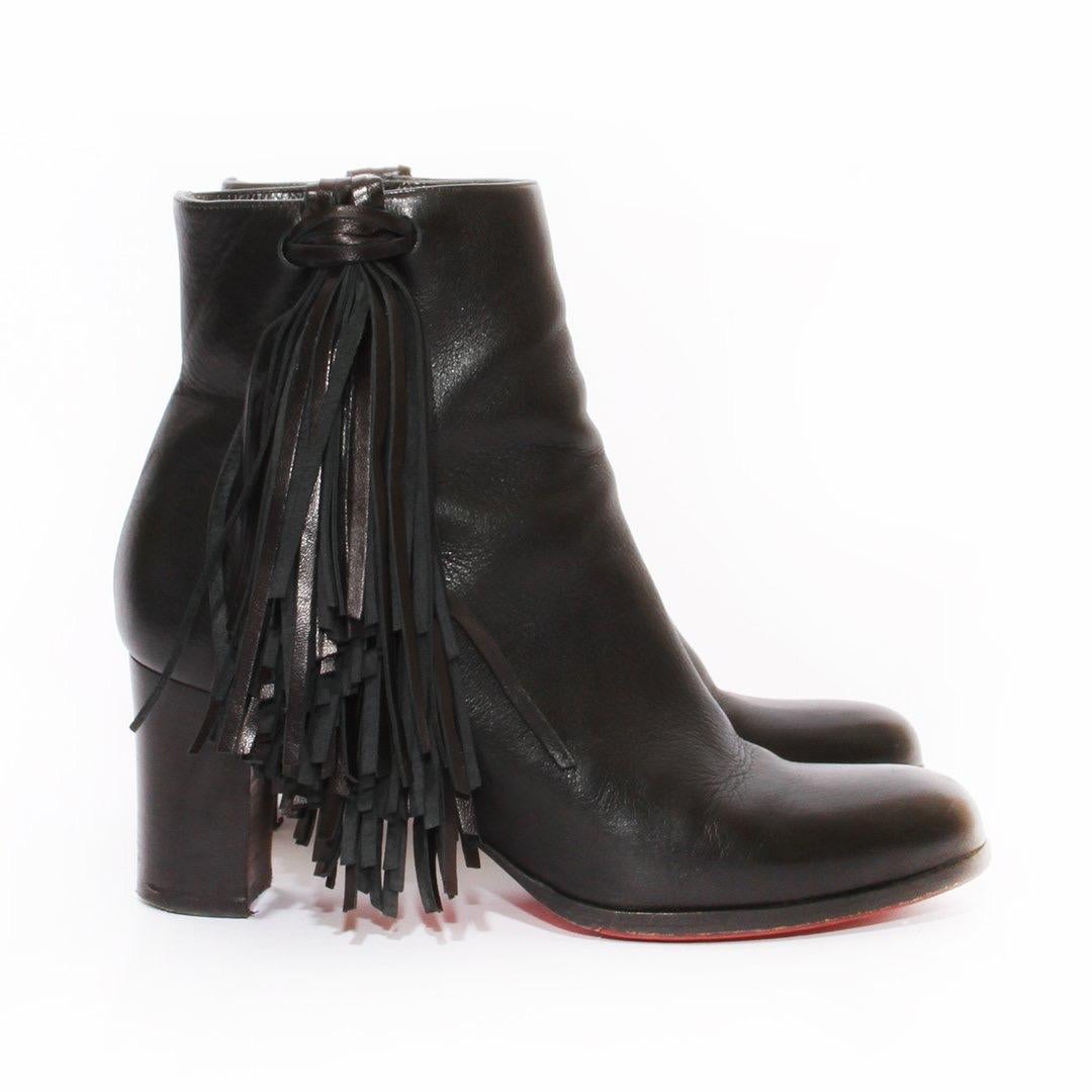 Fringe bootie by Christian Louboutin
Black leather 
Fringe Tassel side detail 
Side zip detail 
Round toe
Classic red bottom 
Made in Italy
Condition: Great, scuffs on sole. Light leather wear. (see photos).

Size/Measurements 
Size 39.5
4
