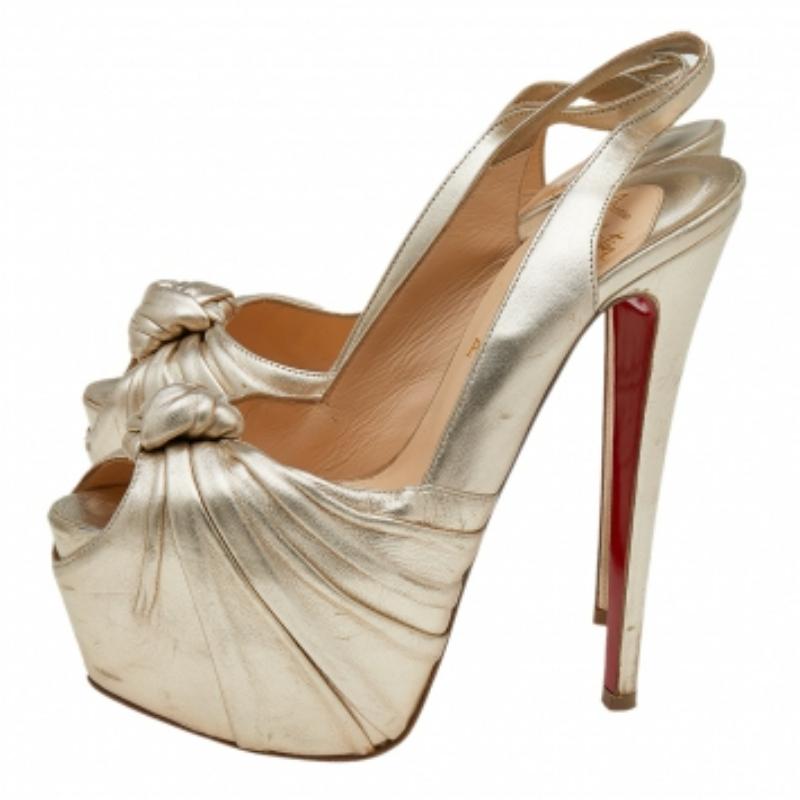 You can count on these sandals from Christian Louboutin for an elevated feel. They are crafted from leather and designed with peep toes, knotted uppers, and slingbacks. The sandals are set on platforms and 15.5 cm heels.