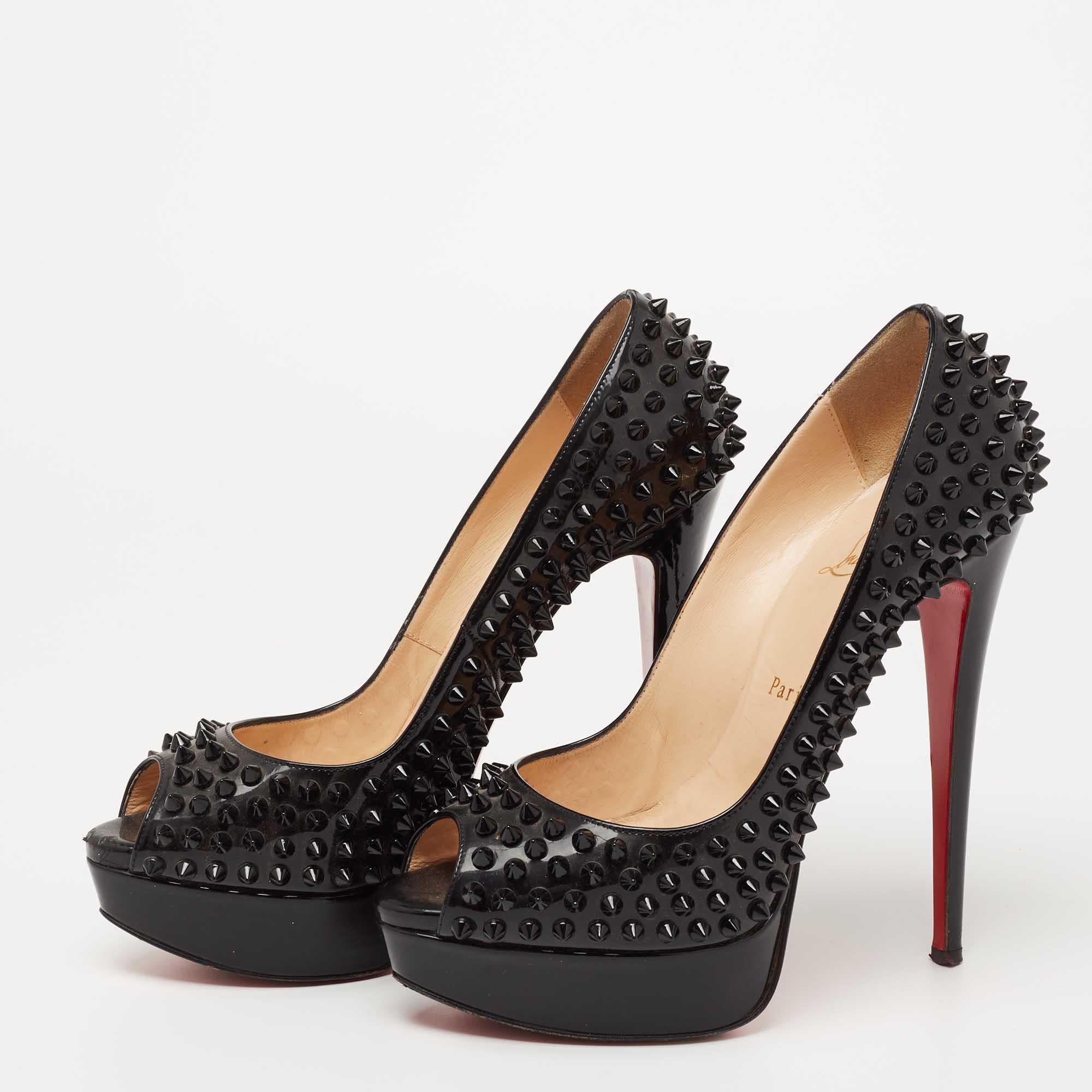 Stand out from the crowd with this gorgeous pair of Louboutins that exude high fashion with class! Crafted from patent leather, this is a creation from their Lady Peep collection. They feature a classic black shade with peep toes and tonal spikes