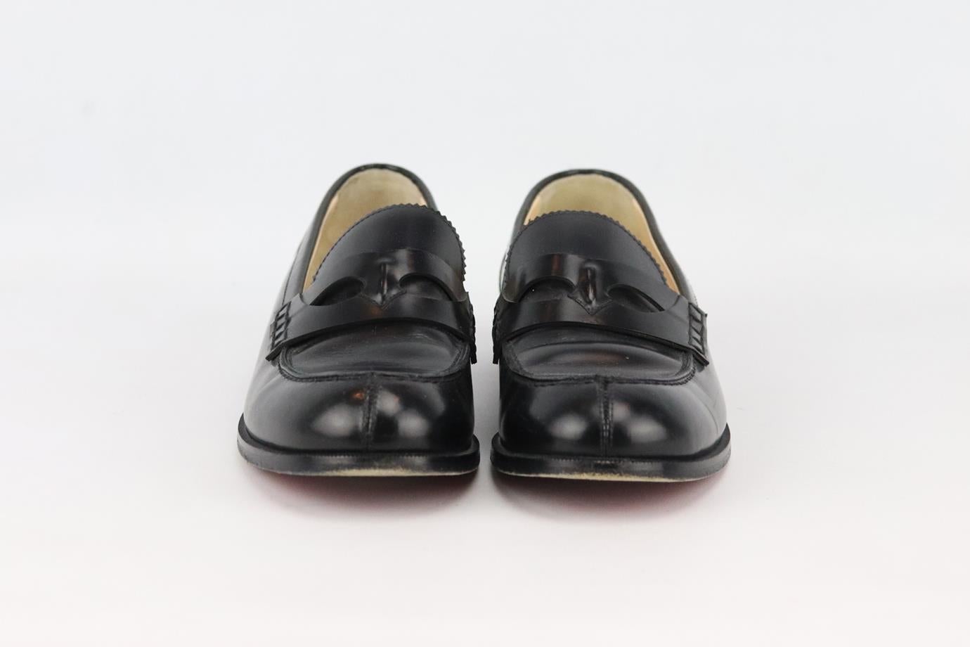 Christian Louboutin leather loafers. Made from black leather in a classic loafer shape set on the brand's iconic red sole. Black. Slips on. Does not come with box or dustbag. Size: EU 37.5 (UK 4.5, US 7.5). Insole: 9.8 in. Heel: 0.6 in