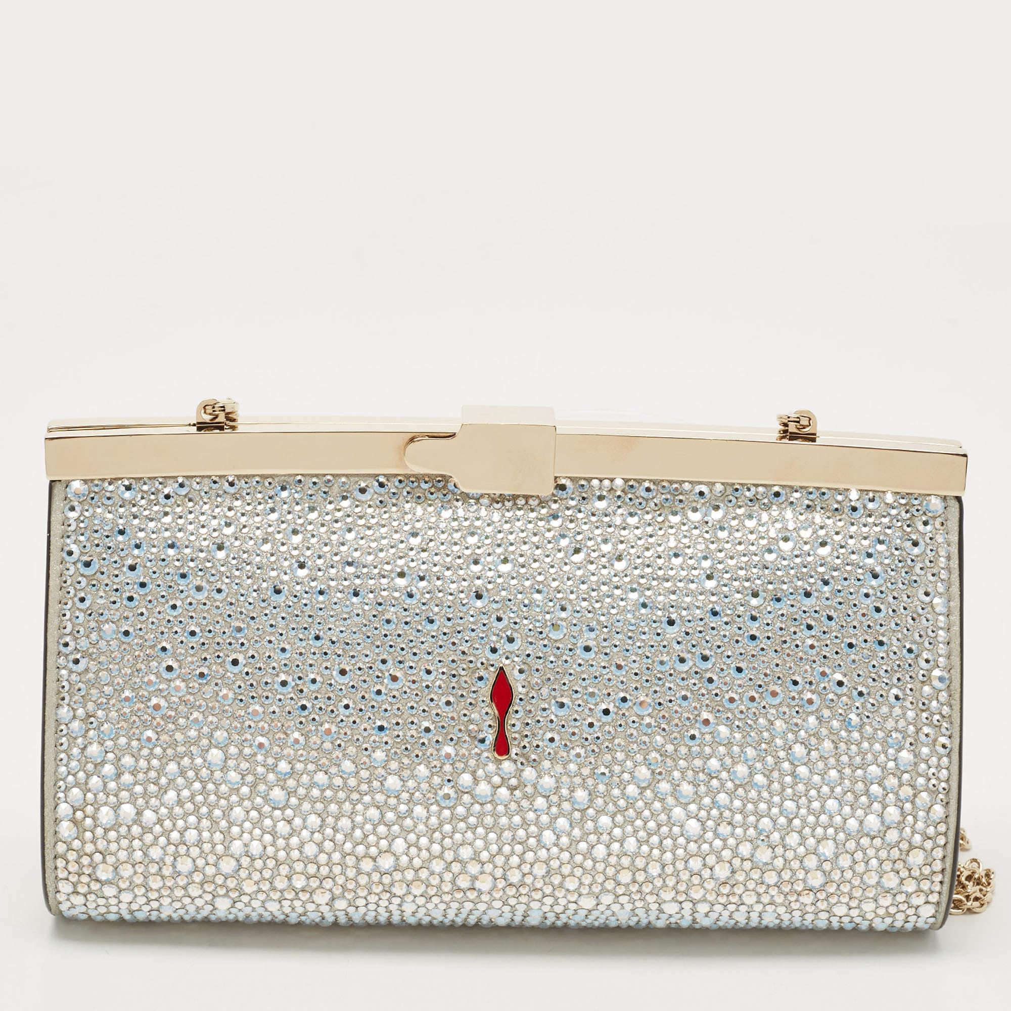 This Christian Louboutin creation is crafted from leather and features shimmering crystals embellished on the exterior. It comes with a shoulder chain, and the top clasp opens to a fabric-lined interior that has enough space to carry your party