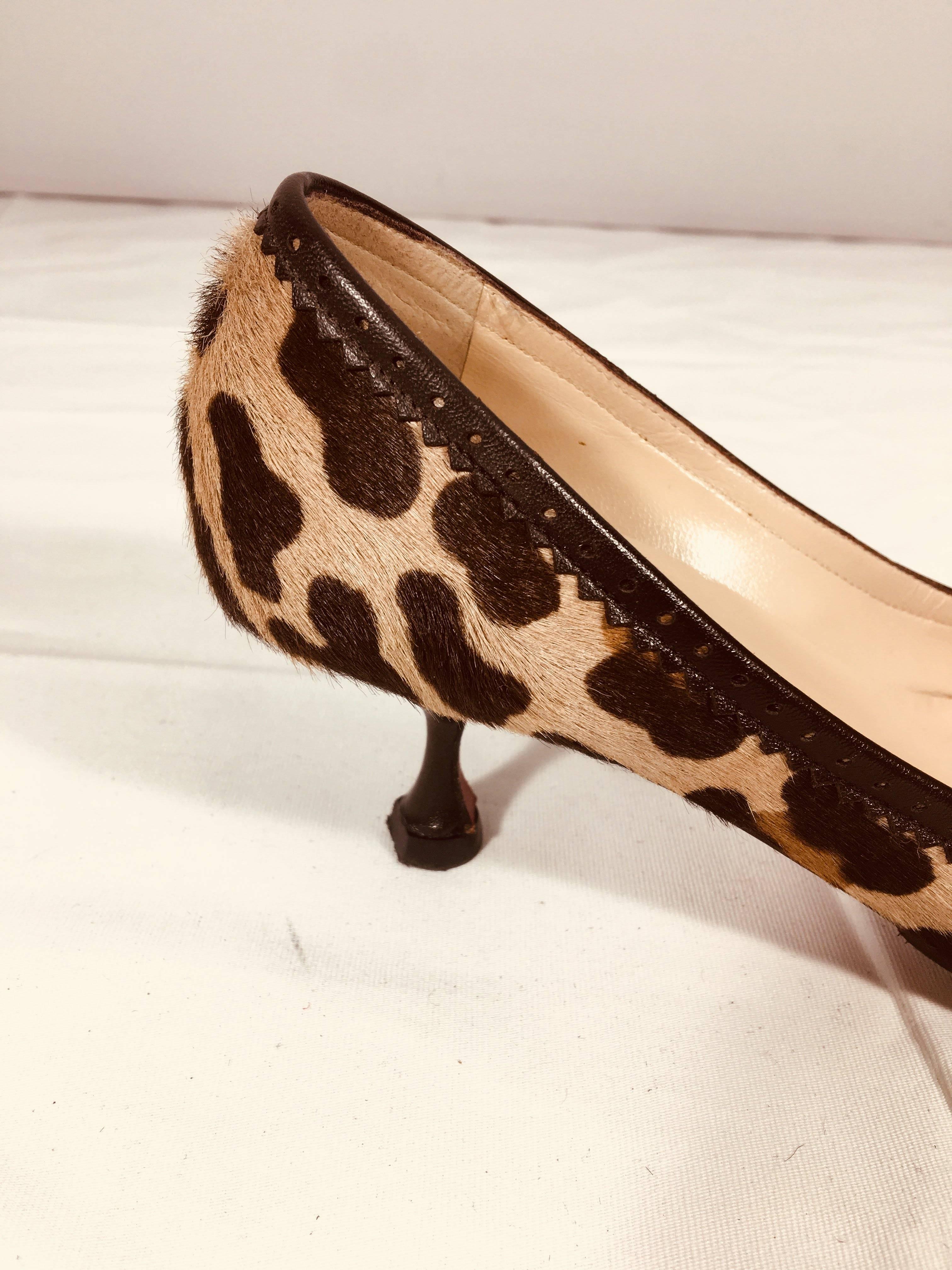 Christian Louboutin Leopard Print Kitten Heels with Round Toe, Leather Trim, and Tassel.