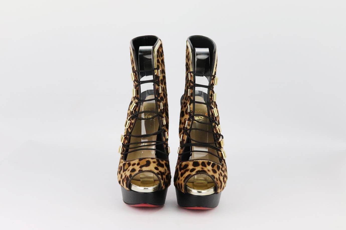 Christian Louboutin leopard print calf hair platform sandals. Made from leopard-print calf-hair with gold-tone lace up fastening and striking heel with the brand’s iconic red sole. Beige, tan and black. Lace up fastening at front. Does not come with