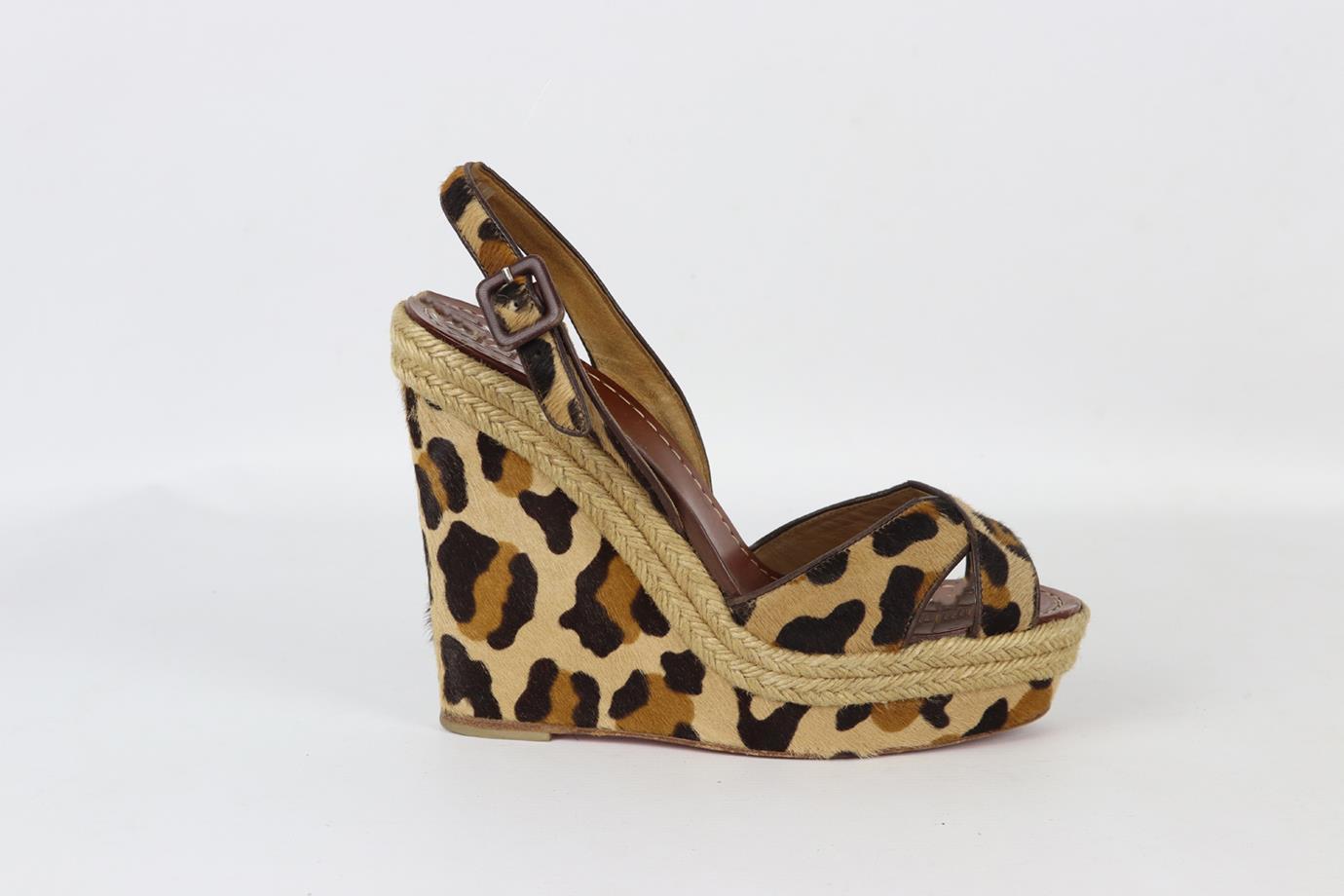 Christian Louboutin leopard print calf hair wedge sandals. Brown, beige and tan. Slip on. Does not come with dustbag or box. Size: EU 39 (UK 6, US 9). Insole: 9.6 in. Heel Height: 5.4 in. Platform: 1.6 in. Very good condition - Wear to soles. Light