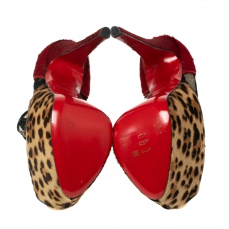 Impeccably crafted into a stylish silhouette, these Aeronotoc booties from Christian Louboutin are truly striking. Featuring black lace, leopard printed pony hair, and red pony hair, the high stiletto shoes make a bold statement and are sure to make