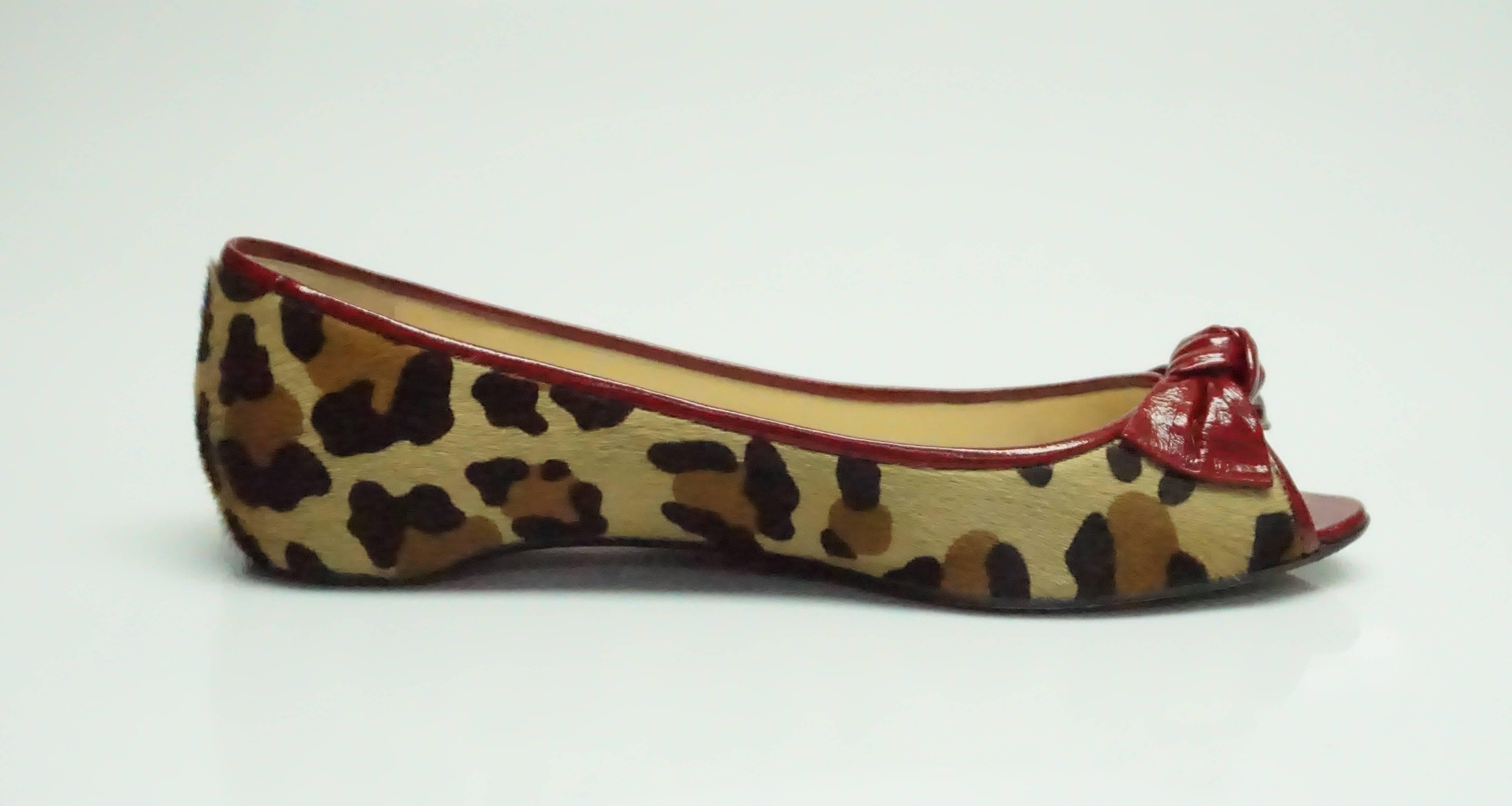 Christian Louboutin Leopard Print Pony Hair Peep Toe w/ Bow Detail Flats - 39  These beautiful flats are in excellent condition. There is little to no wear inside the shoe. The bottom of the shoe has a bit more wear than the inside. 