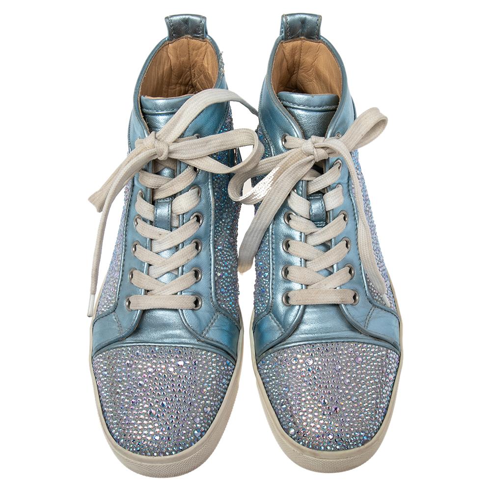 Crafted from leather into a high-top silhouette, these Christian Louboutin sneakers show the label's fine craftsmanship in shoemaking. They are detailed with crystals all over and secured with laces on the vamps.

