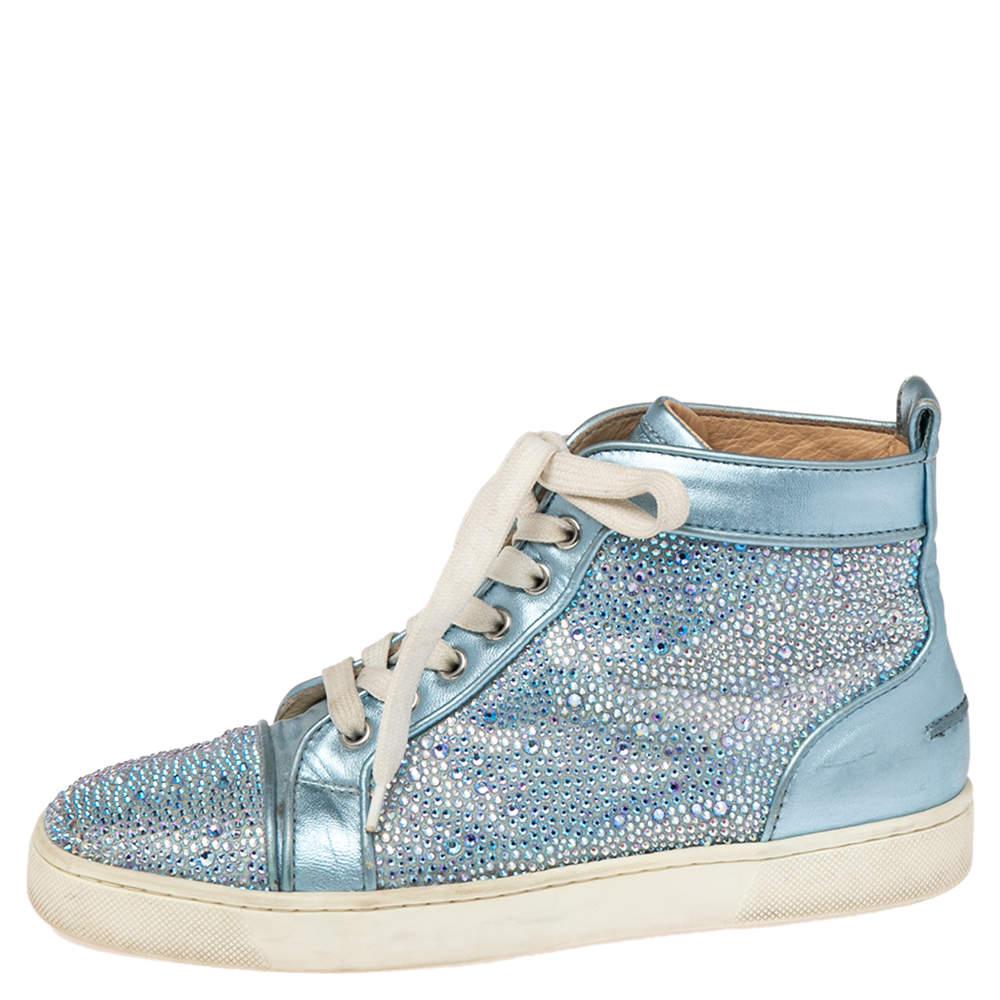 Crafted from leather into a high-top silhouette, these Christian Louboutin sneakers show the label's fine craftsmanship in shoemaking. They are detailed with crystals all over and secured with laces on the vamps.

