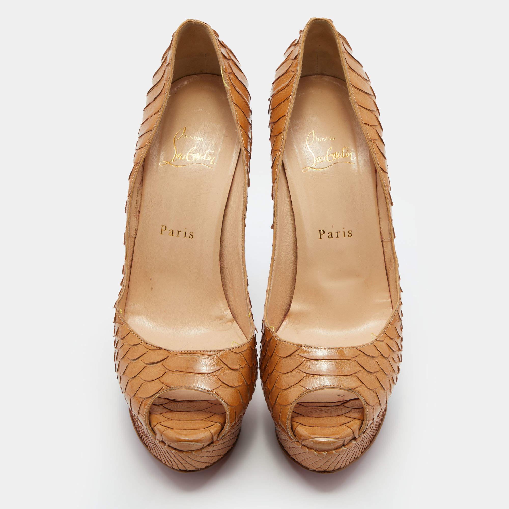 Stand out from the crowd with this luxurious pair of Louboutins that exude high fashion with class. Crafted from python leather, this is a creation from their Lady Peep collection. It features a light brown shade with peep toes and an architectural