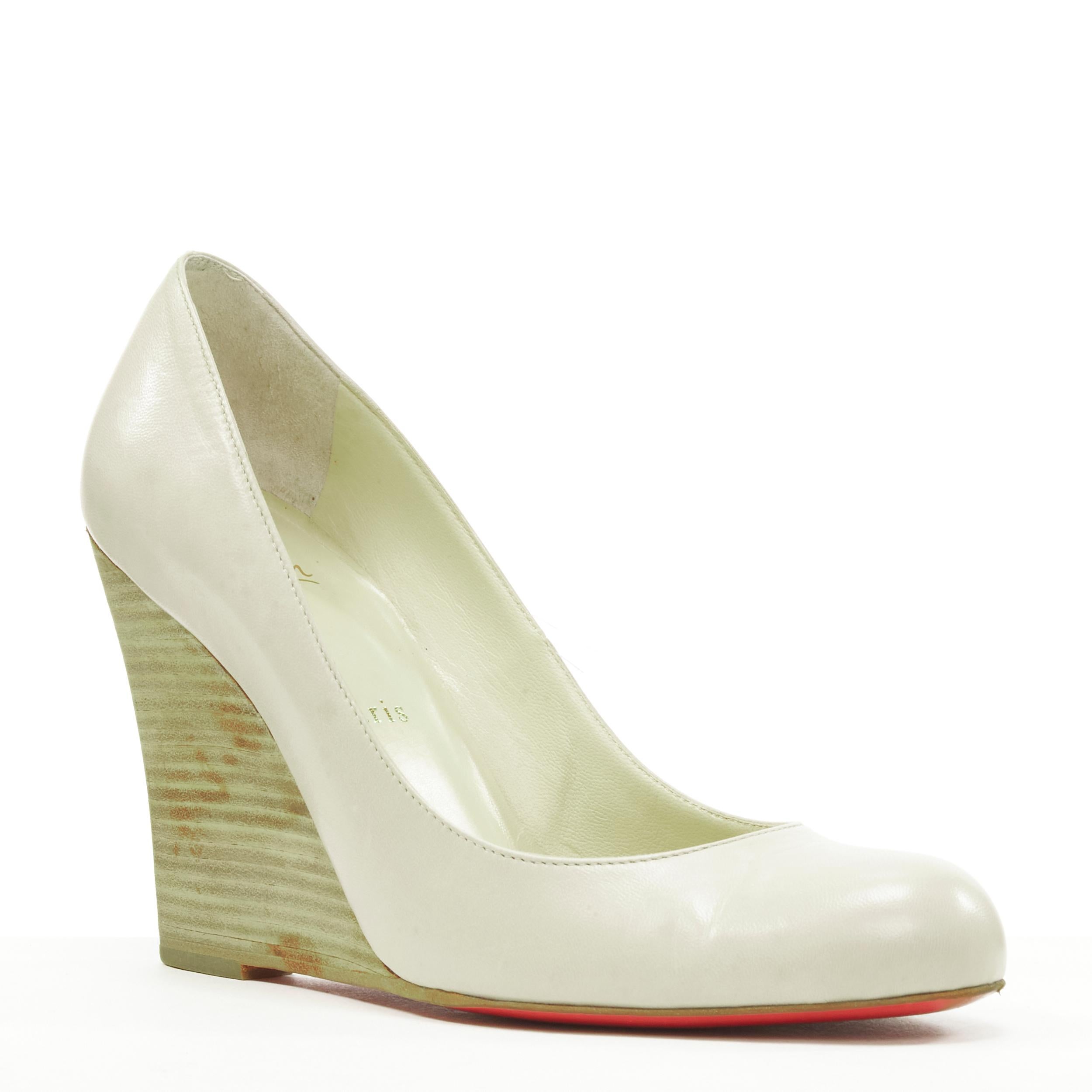 CHRISTIAN LOUBOUTIN light grey leather stacked wooden wedge heel EU37.5 
Reference: SNKO/A00183 
Brand: Christian Louboutin 
Material: Leather 
Color: Grey 
Pattern: Solid 
Extra Detail: Matte stacked wooden wedge. 
Made in: Italy 

CONDITION: