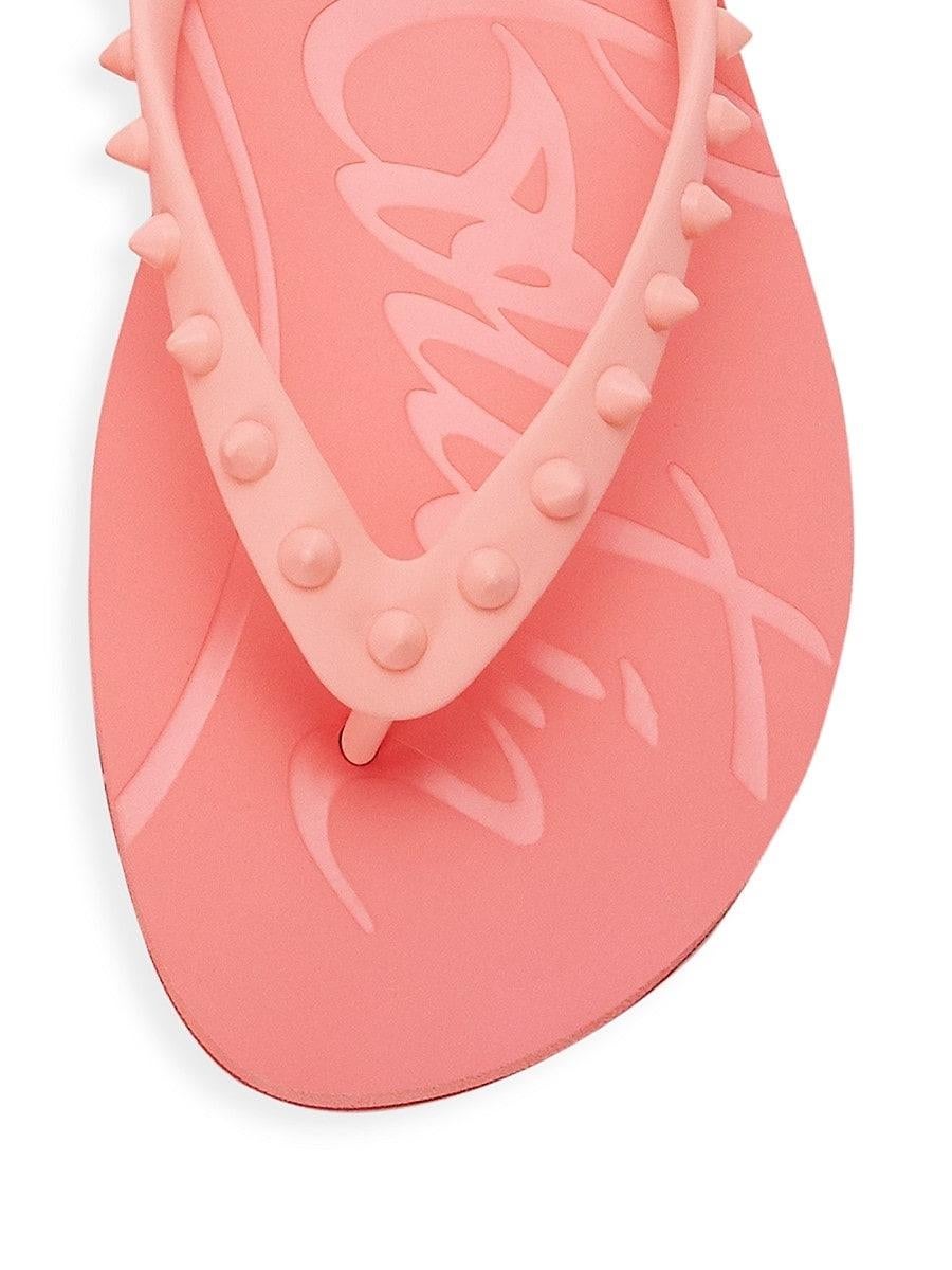 Edgy studding defines these pink beachy rubber flip flops. Open round toe. Thong-style strap. Logo embossed at footbed. Signature red rubber sole. Made in Italy.