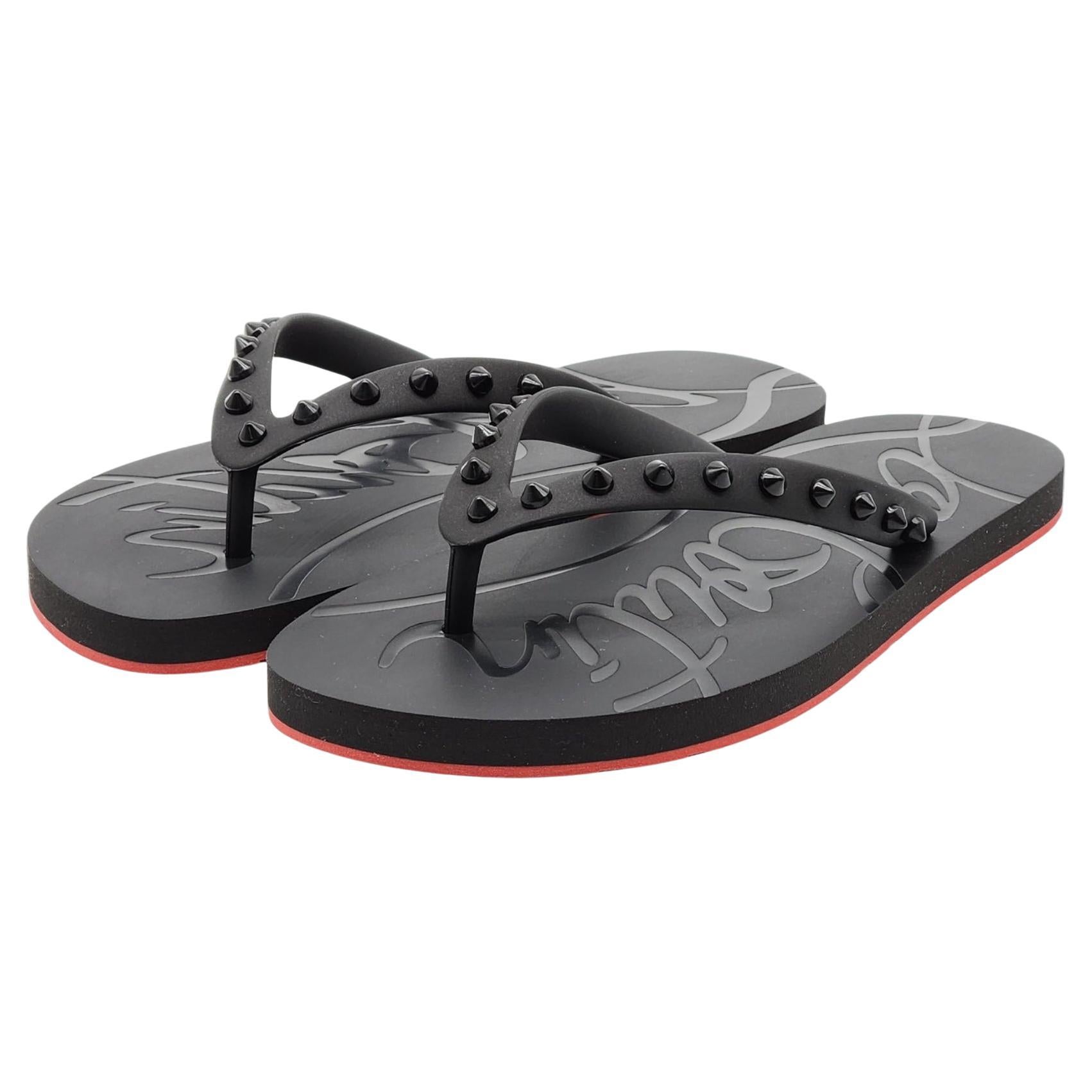 Christian Louboutin Loubi Flip Tongs cloutées en noir en vente
