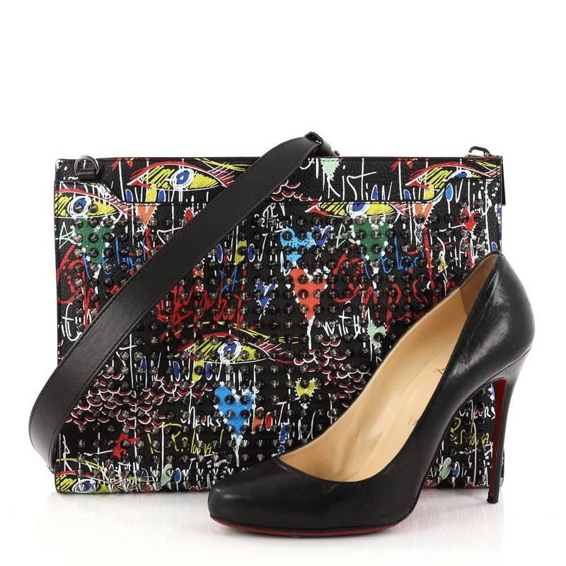 This authentic Christian Louboutin Loubiclutch Spiked Printed Leather is an edgy choice for your evening look. Crafted from multi-colored spiked printed leather, this clutch features removable leather strap, and gunmetal-tone hardware accents. Its