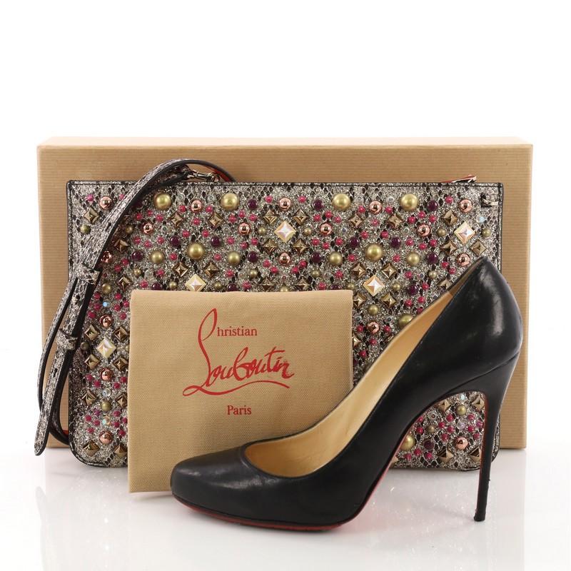 This Christian Louboutin Loubiclutch Spiked Python Embossed Leather, crafted in gold spiked python embossed leather, features multiple studs and gold-tone hardware. Its zip closure opens to a red fabric interior with slip pocket. **Note: Shoe