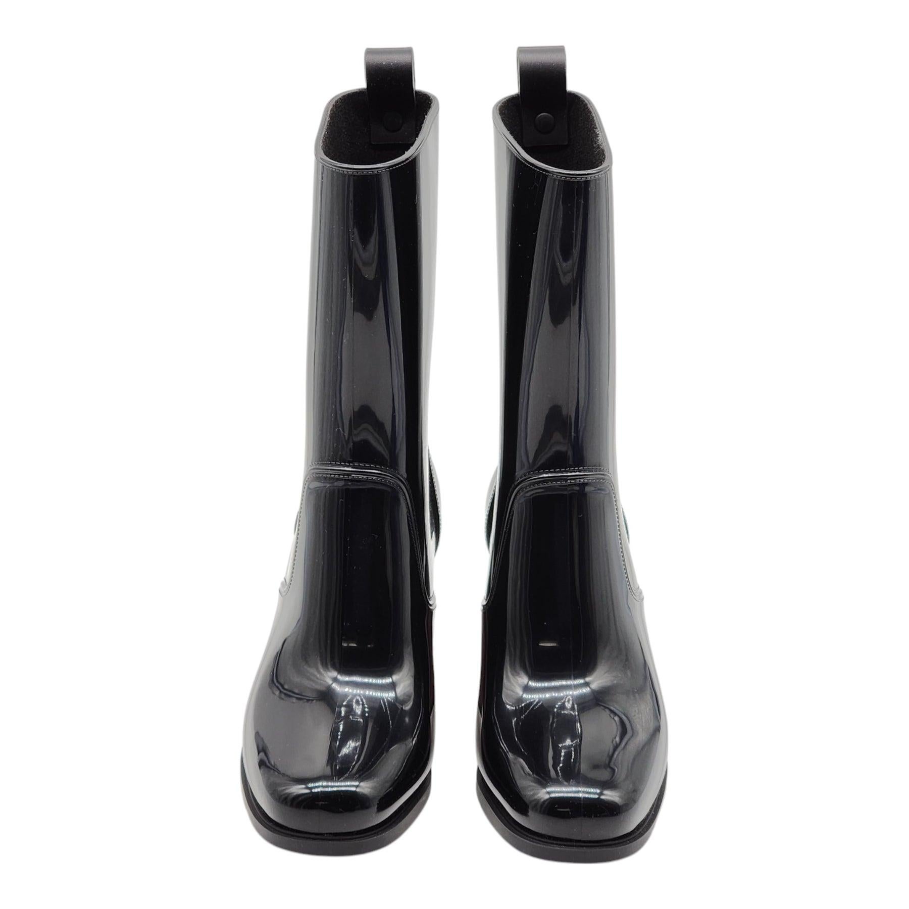 Christian Louboutin Loubirain Boots - PVC in Black Size 35.

Additional information:
Material: PVC upper, rubber bottoms
Color: Black
Size 35 (4.5 US)
Country: Italy
Dimension: Heel height 70mm (2.75 inches)
Condition: Brand new with box.