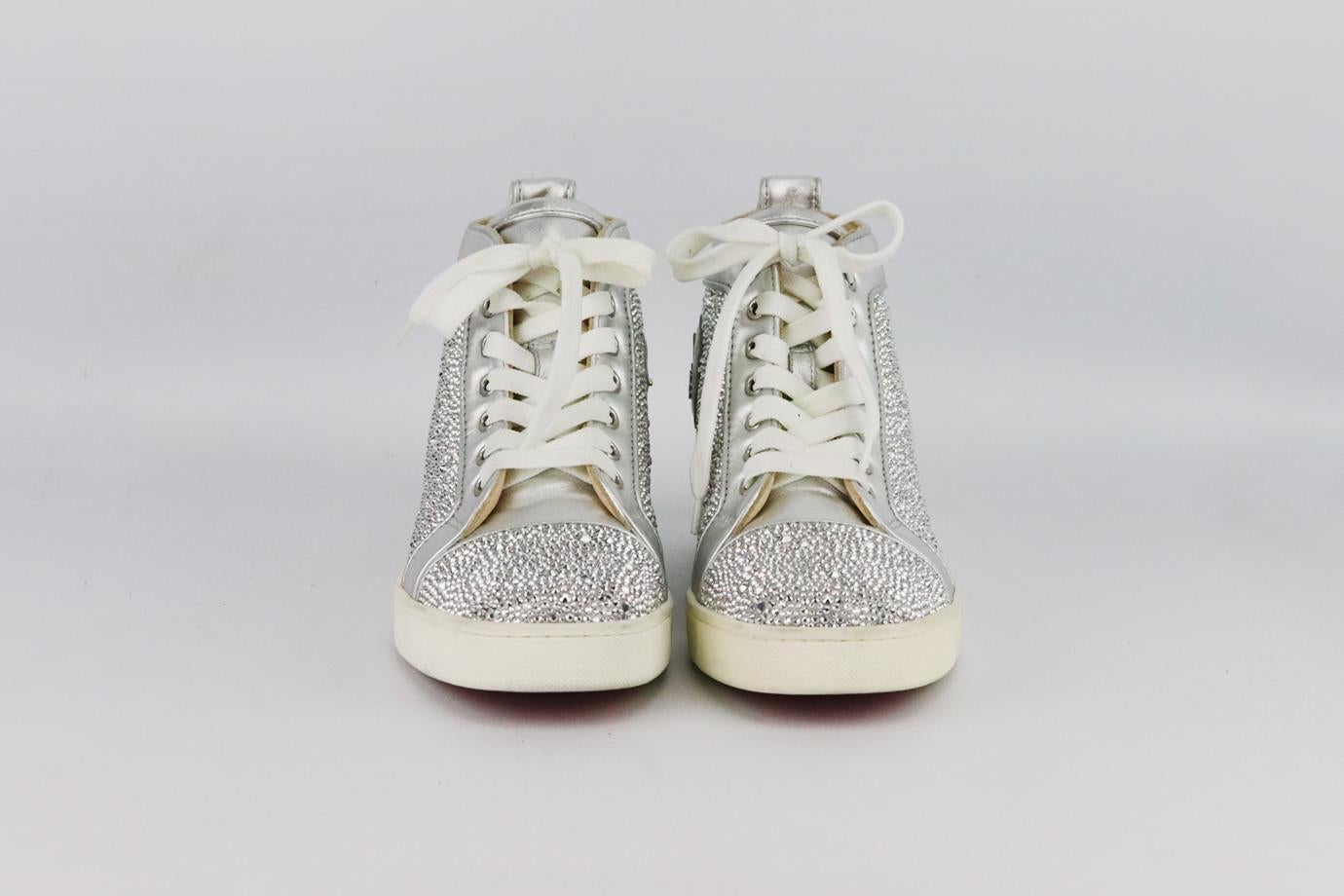 Christian Louboutin Louis embellished leather high top sneakers. Made from silver leather with crystal embellishment throughout and finished with the brand’s iconic red sole. Silver. Lace up fastening at front. Does not come with box or dustbag.
