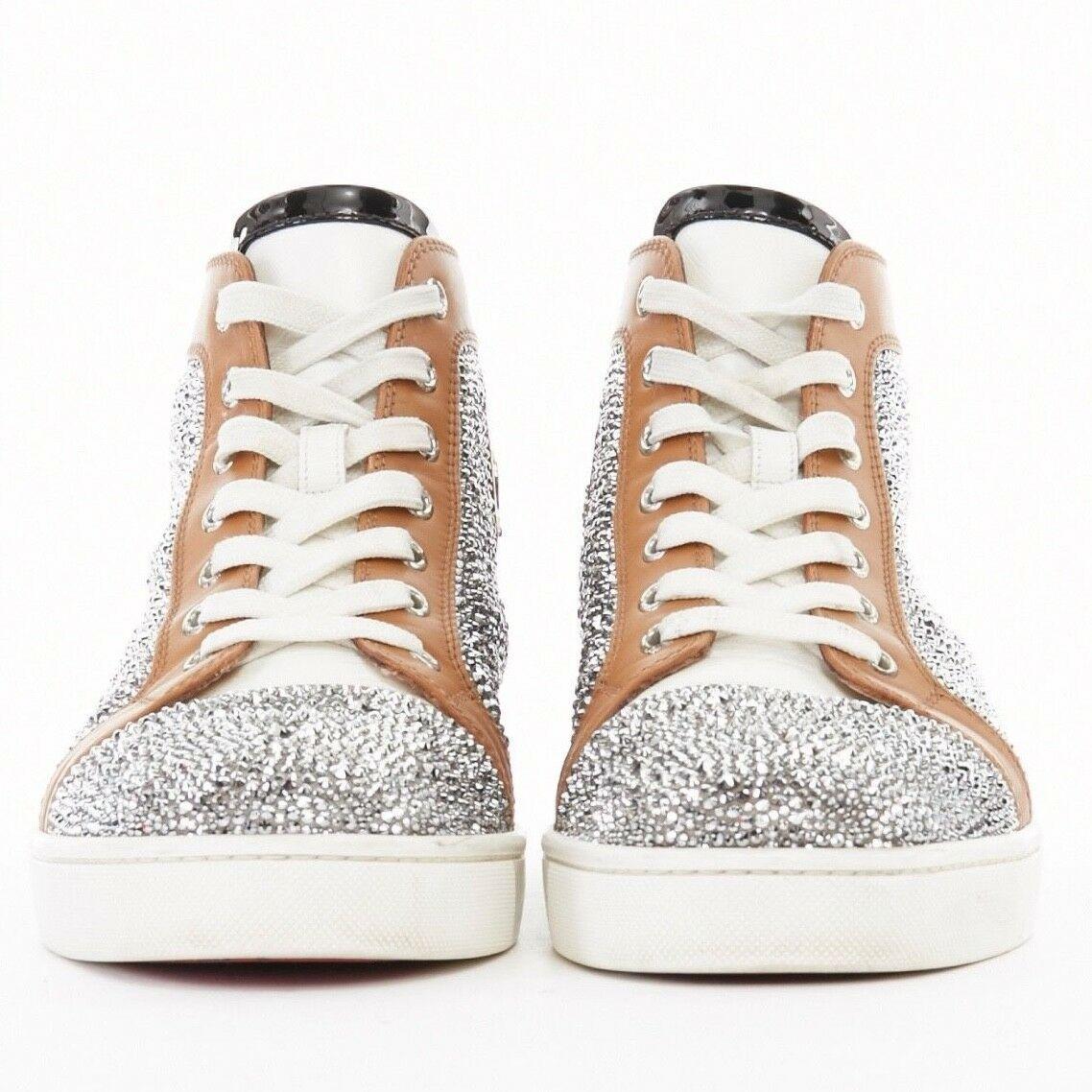 CHRISTIAN LOUBOUTIN Louis flat silver strass crystal high top sneakers EU42 US9

CHRISTIAN LOUBOUTIN
Louis Flat Strass sneakers. Caramel brown and black leather detail. Swavovski crystal strass embellishment on side and at toe. Lace up front. Patent