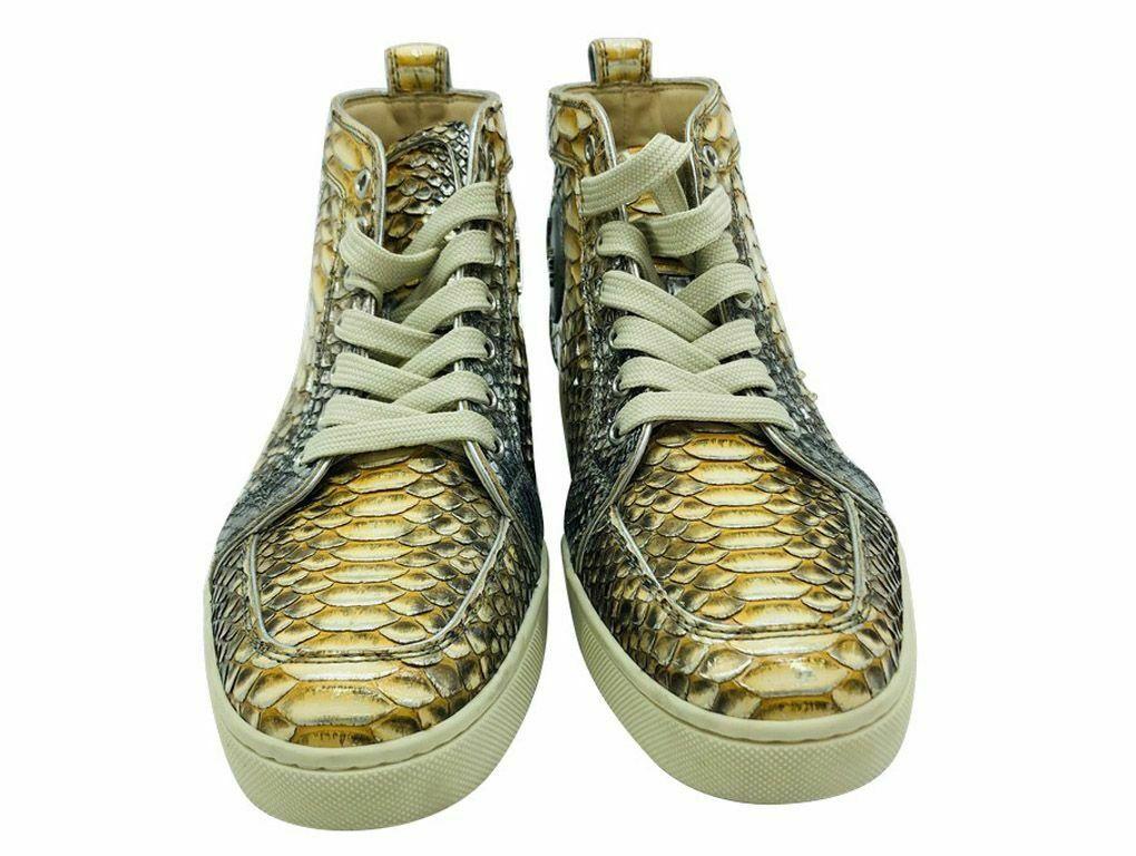 A LOVELY PAIR OF LOUBOUTIN LOUIS PYTHON LEATHER HIGH TOP TRAINERS FOR SALE IN A SIZE 40. A PRE-LOVED PAIR IN EXCELLENT CONDITION.

BRAND	
Christian Louboutin

COLOUR	
Gold, Silver

ACCESSORIES	
Dust bag

CONDITION	
Used –