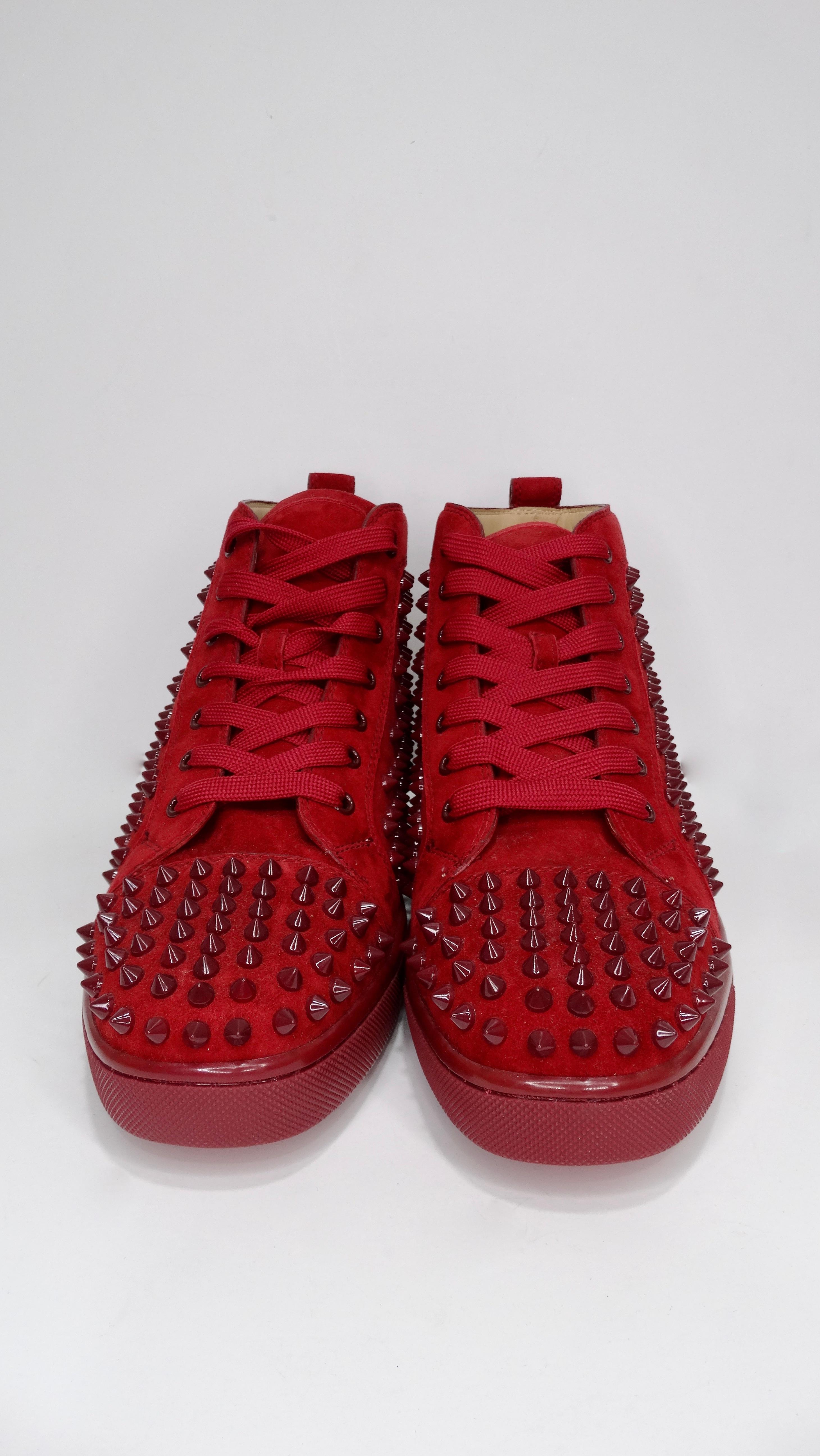 Elevate your look with these show stopping sneakers. Featuring a deep red suede and spikes throughout, these sneakers were originally created in 2009 and have had multiple variations and styles since then, including these from 2014. Pair with black