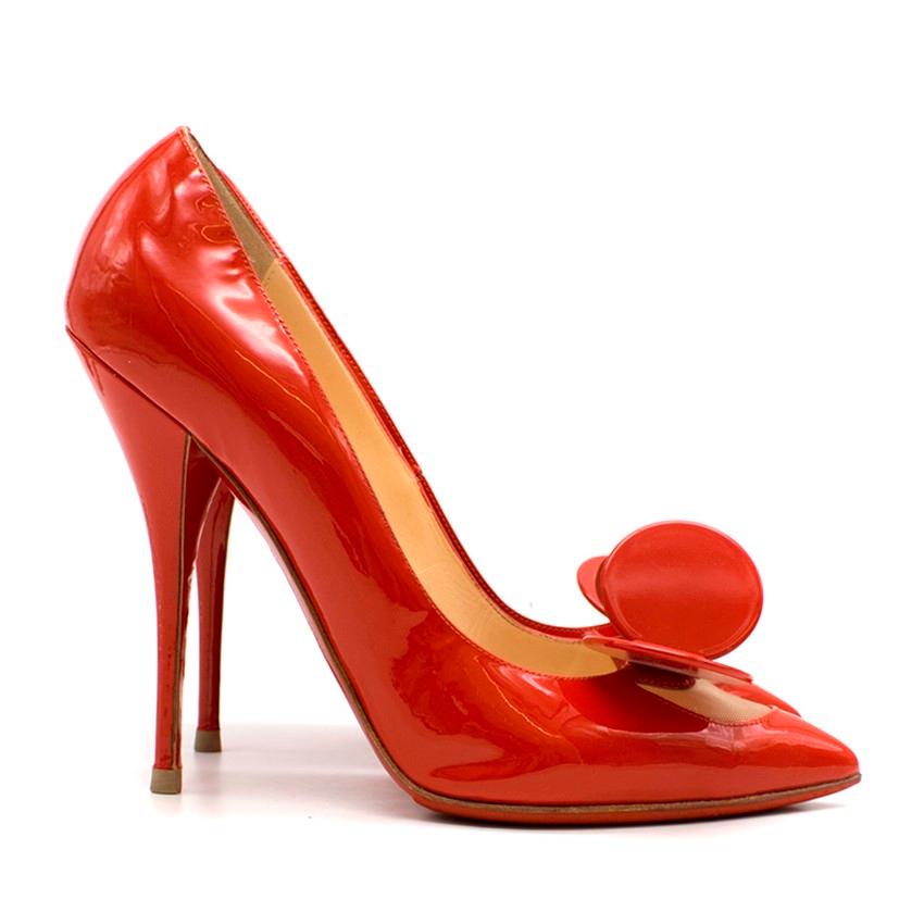 Christian Louboutin Madame Mouse patent-leather pumps
 
 - Red, patent leather,
 - Point toe, leather-covered high stiletto heel
 - Nude mesh front panel, red plastic Madamme Mouse embellishment
 - Nude leather lining, signature red leather sole
 -
