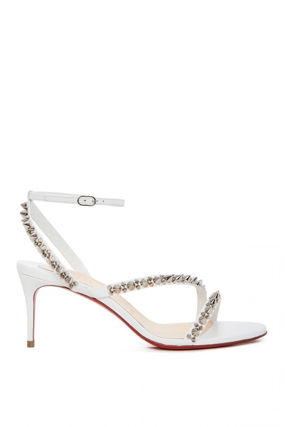 Christian Louboutin's Mafaldina Spikes sandals merge the sensual with the rebellious. Comprised of barely-there leather straps with tough-luxe studs, they're complete with soles dipped in house-signature red lacquer. Modest 70mm heels make for