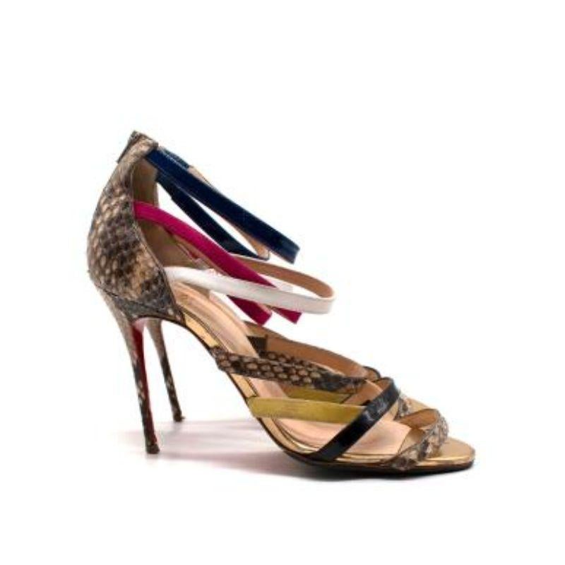 Christian Louboutin Mariniere 100 Multicoloured Python Sandals

- Snakeskin heel and straps
- Multi-color suede and leather straps
- Iconic red bottoms

Condition: 9.5/10, excellent!

Material: 
Snakeskin
Leather

Made in Italy.

PLEASE NOTE, THESE