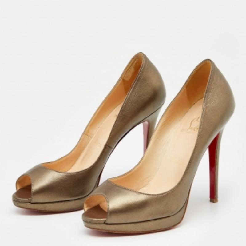 Add a luxurious edge to your outfit by wearing these stunning pumps from Christian Louboutin. They are made using metallic bronze leather on the exterior and are adorned with peep-toes and platforms. The beautiful pumps are defined with slender