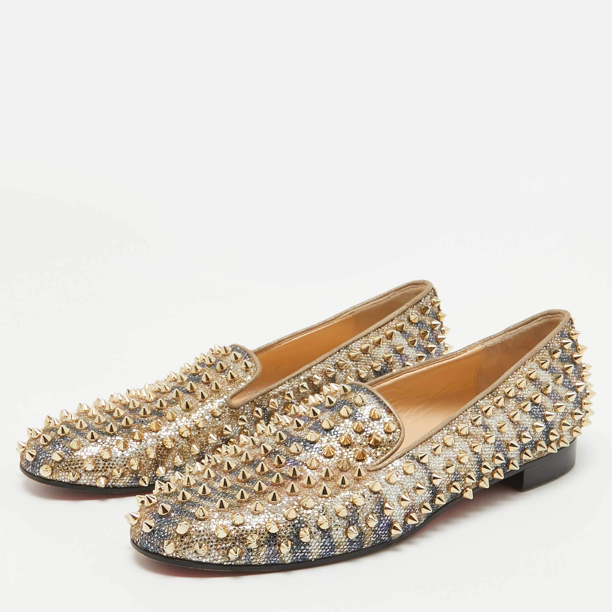Christian Louboutin is known for its meticulously crafted designs. These loafers have been crafted from glitter into a sleek shape flaunting gold tone spikes all over. Team them with slim fit trousers and a shirt for a smart casual look.