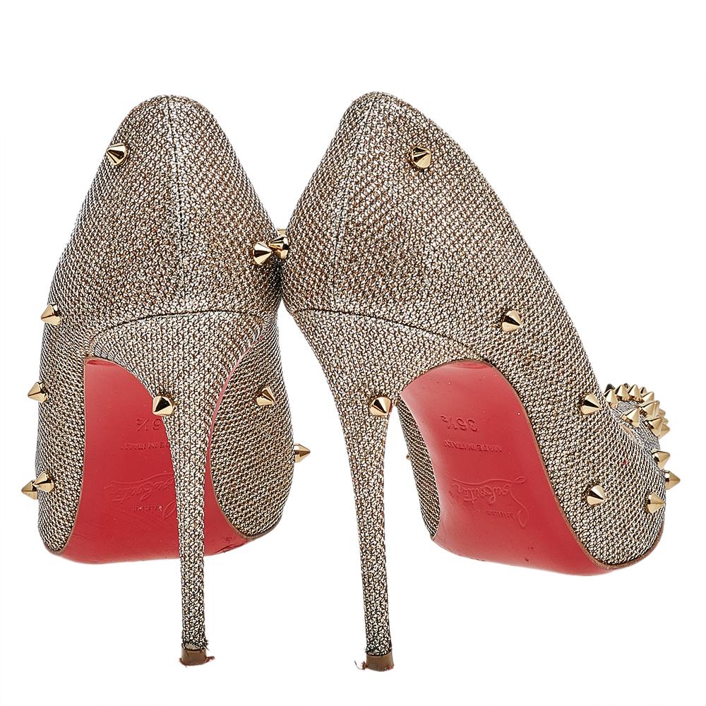 Command attention and admirable gasps from your audience with each step you take in these pumps from Christian Louboutin. Crafted from metallic fabric, they carry pointed toes and spikes decorated all over. The pair is complete with 10 cm heels, and