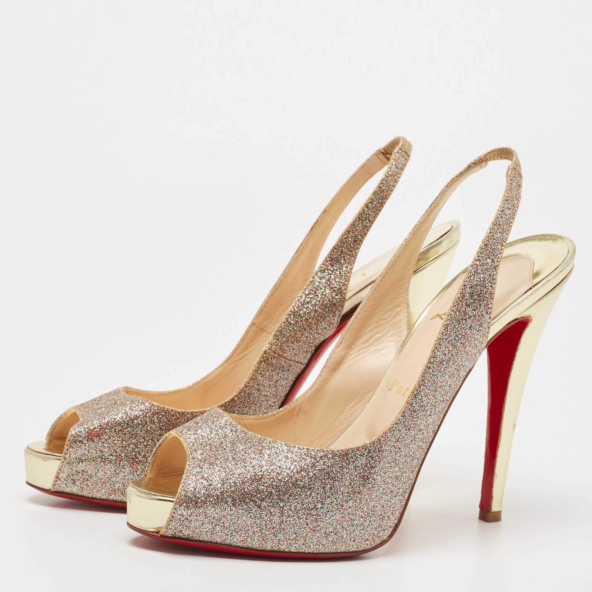 This pair of Christian Louboutin sandals infuse a touch of sophistication into your outfit. Constructed from metallic gold glitter, the expertly placed cuts and the sleek heels signify the brand's expertise in creating impressive designs. The