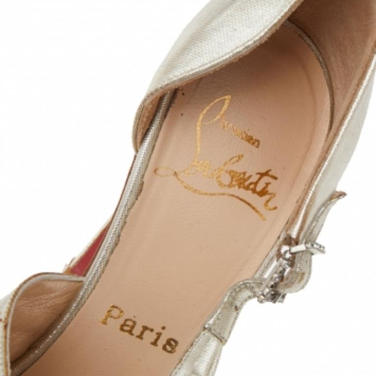 These beautiful D'Orsay pumps from the House of Christian Louboutin will certainly make your feet appear spectacular. They are created using metallic-gold lamé fabric on the exterior and flaunt ruffled detailing on the front. They are completed with