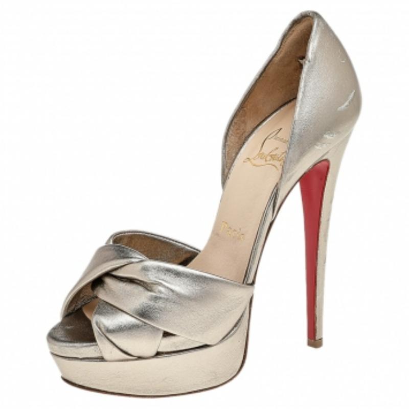 These classic pumps from the house of Christian Louboutin are that versatile pair that you can wear with many of your outfits. It features a leather body with crisscross straps on the front, set on a platform sole, and comes with a tall heel. This