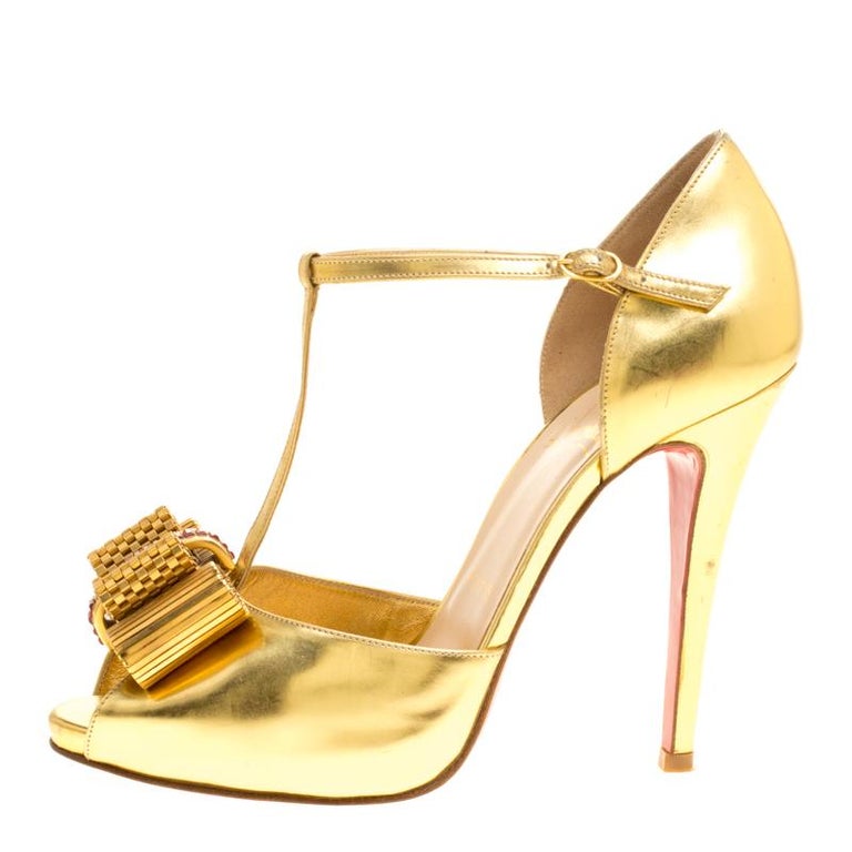 louboutin gold strappy heels