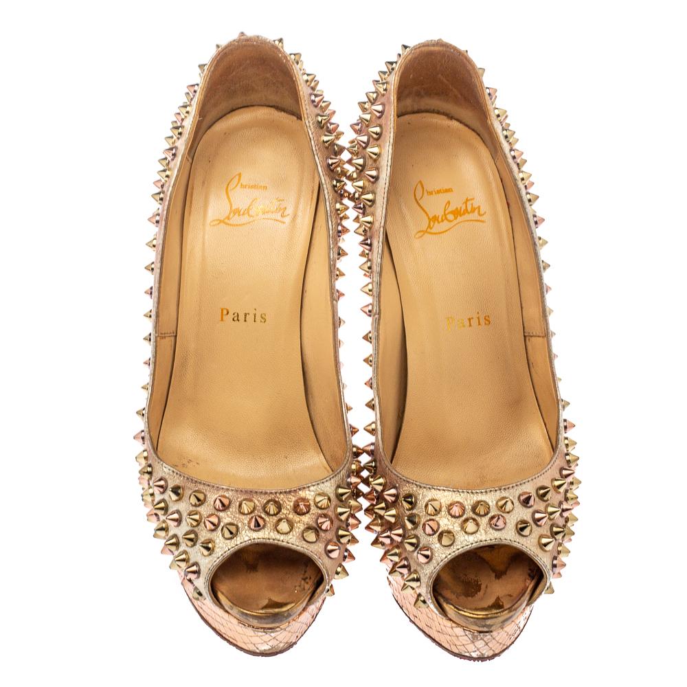 Stand out from the crowd with this gorgeous pair of Louboutins that exude high fashion with class! Crafted from rose gold leather, this is a creation from their Lady Peep collection. They are studded with gold-tone studs and have peep-toes.