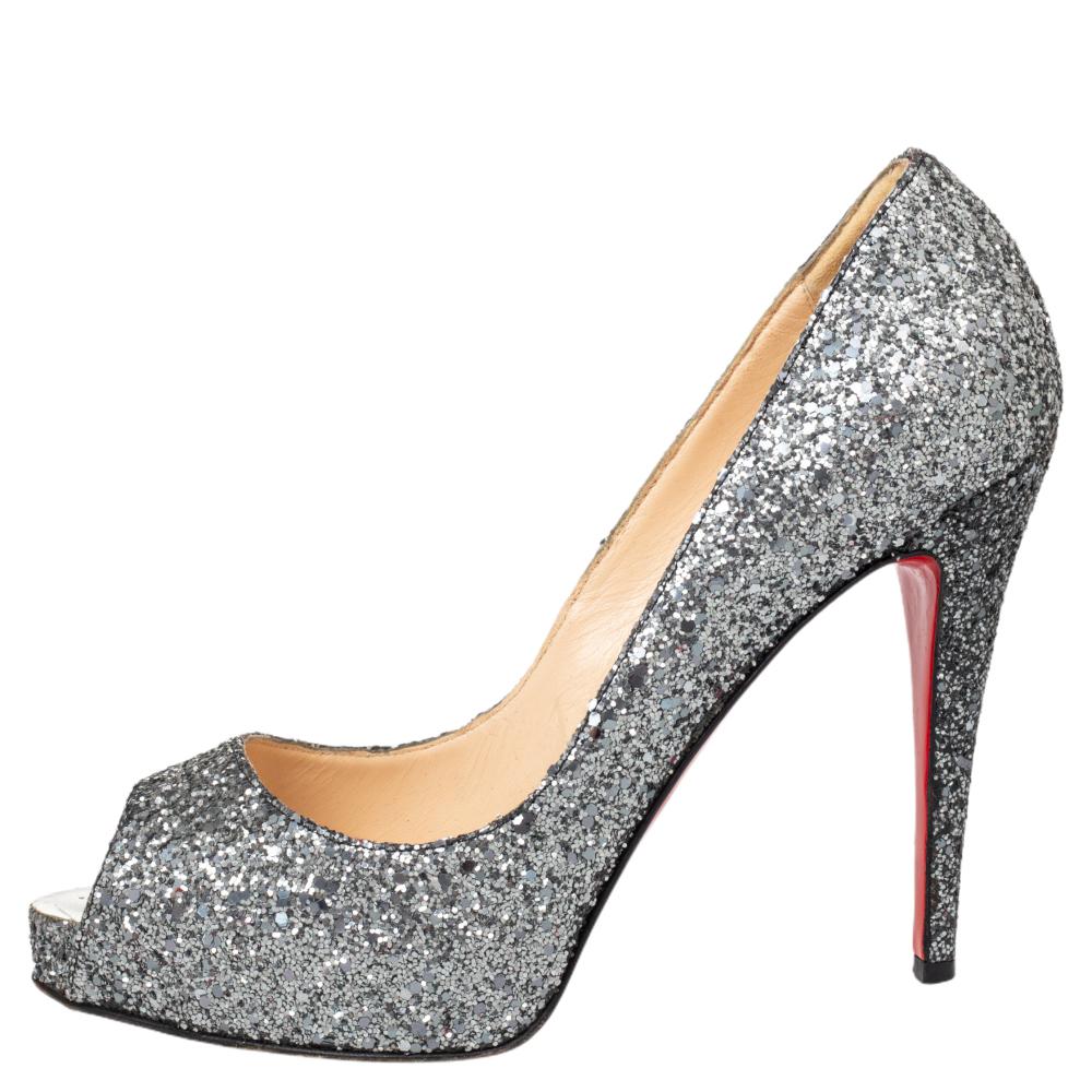This pair of Christian Louboutin pumps is a timeless classic. Step out in style while flaunting these glittery shoes, ideal for all occasions. They feature peep toes, platforms, and 12 cm heels.

Includes: Original Dustbag
