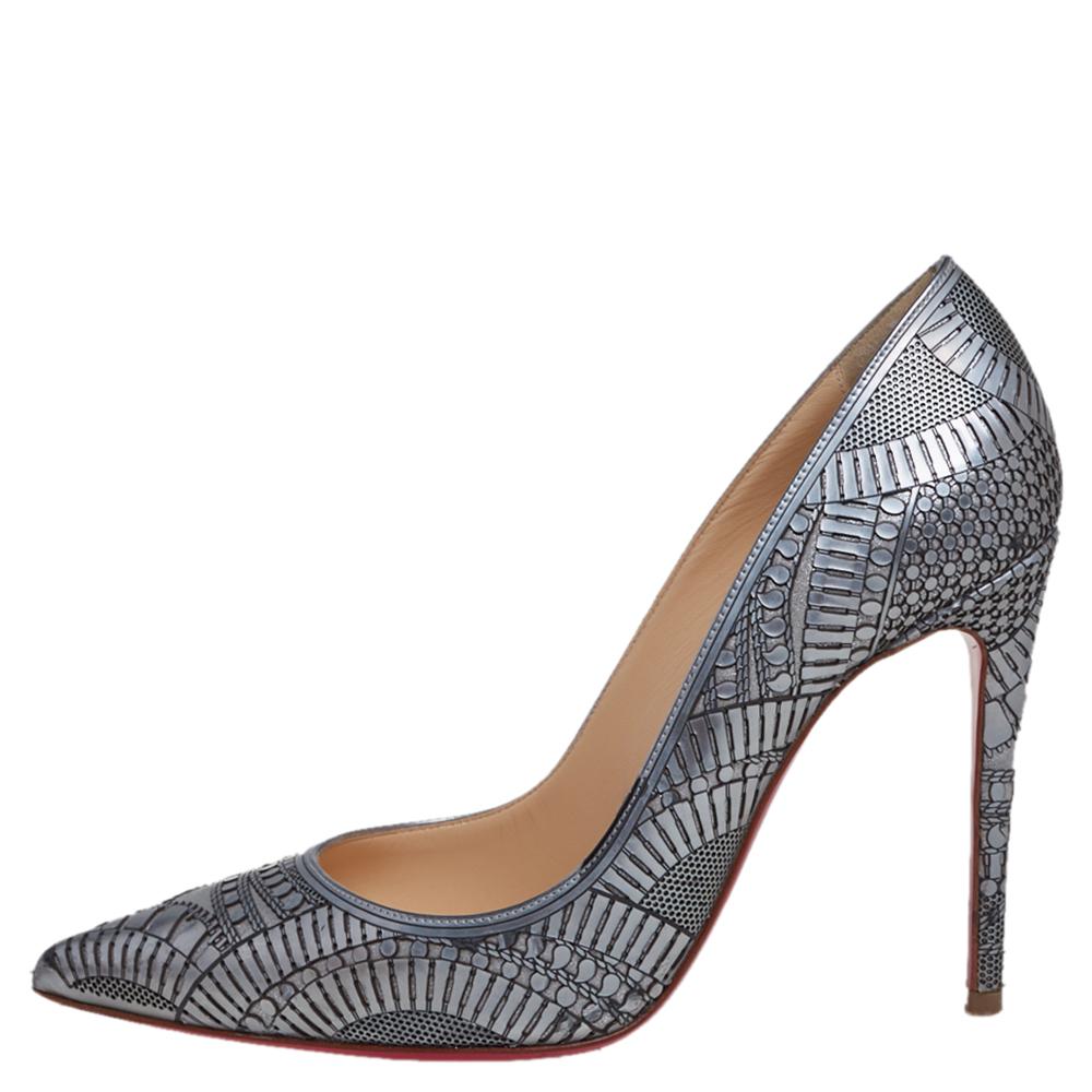Introduce bold sophistication to your closet with these stunning Kristali pumps from Christian Louboutin. Doused in a metallic silver hue, these pumps are rendered in leather with laser-cut details and styled with pointed toes and 10.5 cm stiletto
