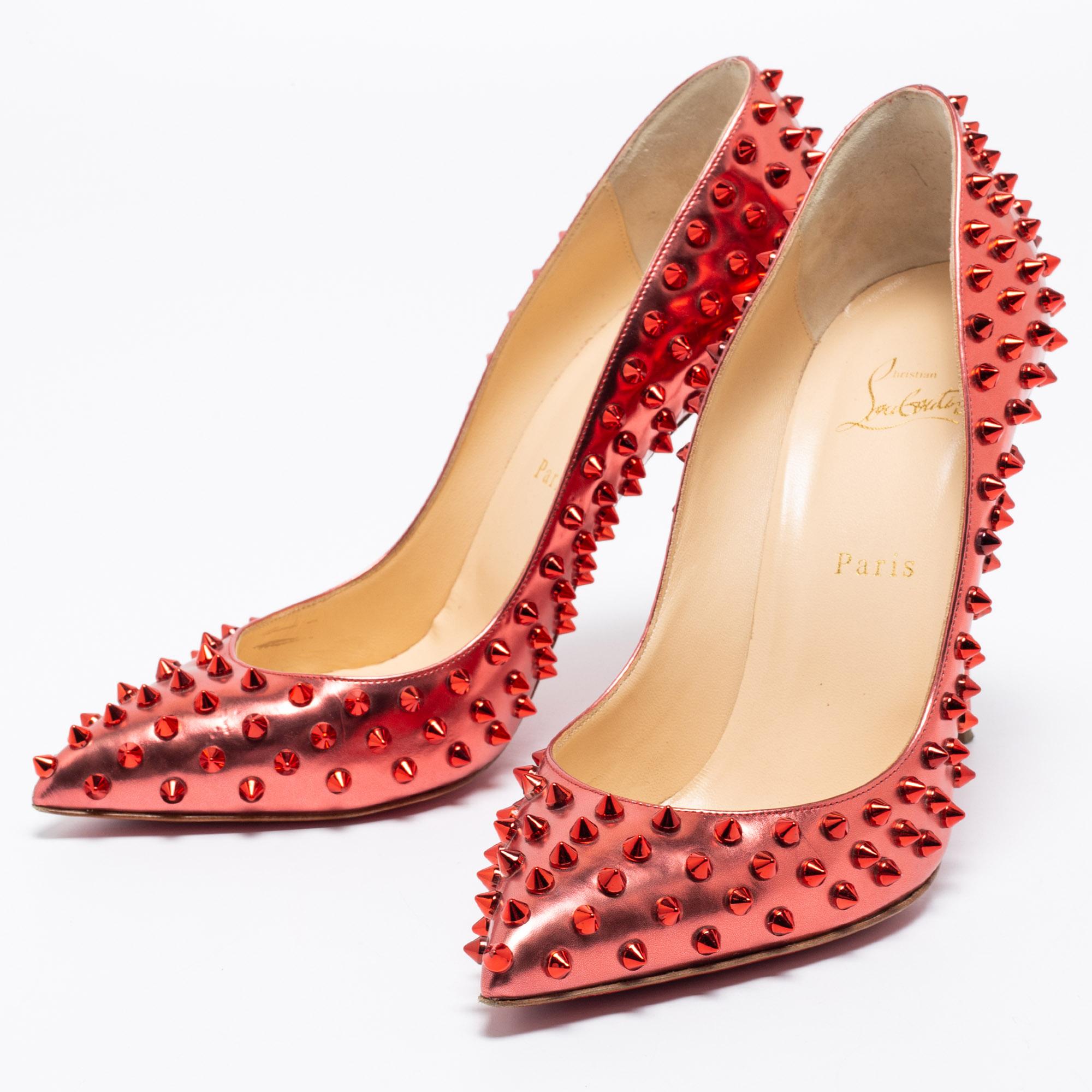 Dazzle everyone with these Louboutins by owning them today. Crafted from red leather, these CL pumps carry a mesmerizing shape with pointed toes, spike embellishments on the exterior, and high heels. Complete with the signature red soles, this pair
