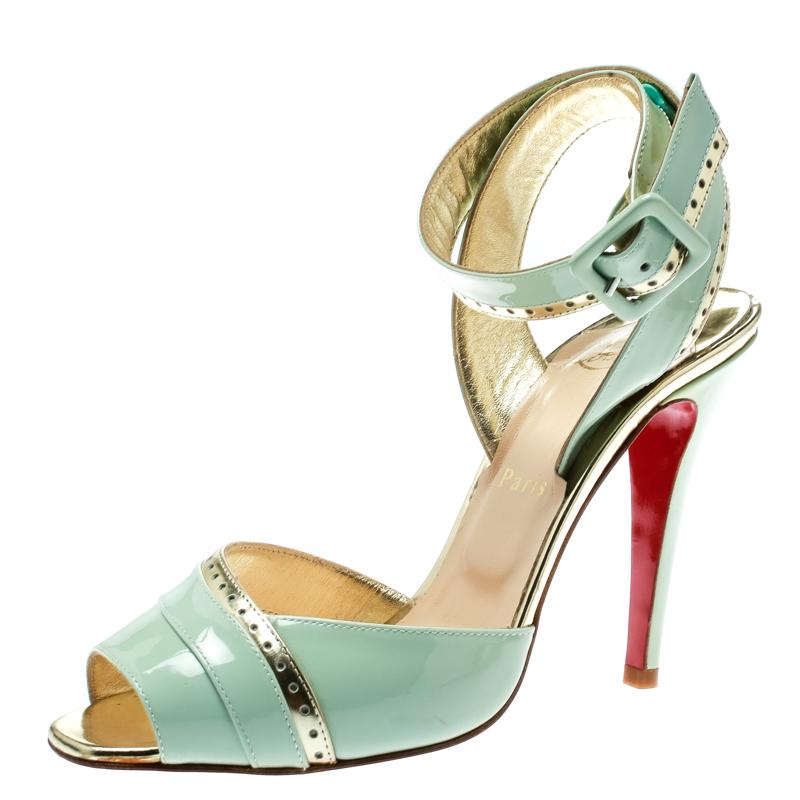 These sandals from Christian Louboutin will lend a stylish and playful edge to your feet. Crafted from patent leather, they carry a mix of mint green and gold, ankle wraps and stiletto heels. These beauties will accentuate your look and complement