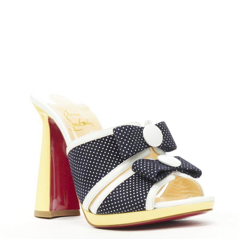 CHRISTIAN LOUBOUTIN Miss Daisy 120 navy polka dot bow platform mule EU36.5
Reference: TGAS/B01006
Brand: Christian Louboutin
Model: Miss Daisy 120
Material: Patent Leather, Suede
Color: Navy, Yellow
Pattern: Polka Dot
Lining: Leather
Extra Details: