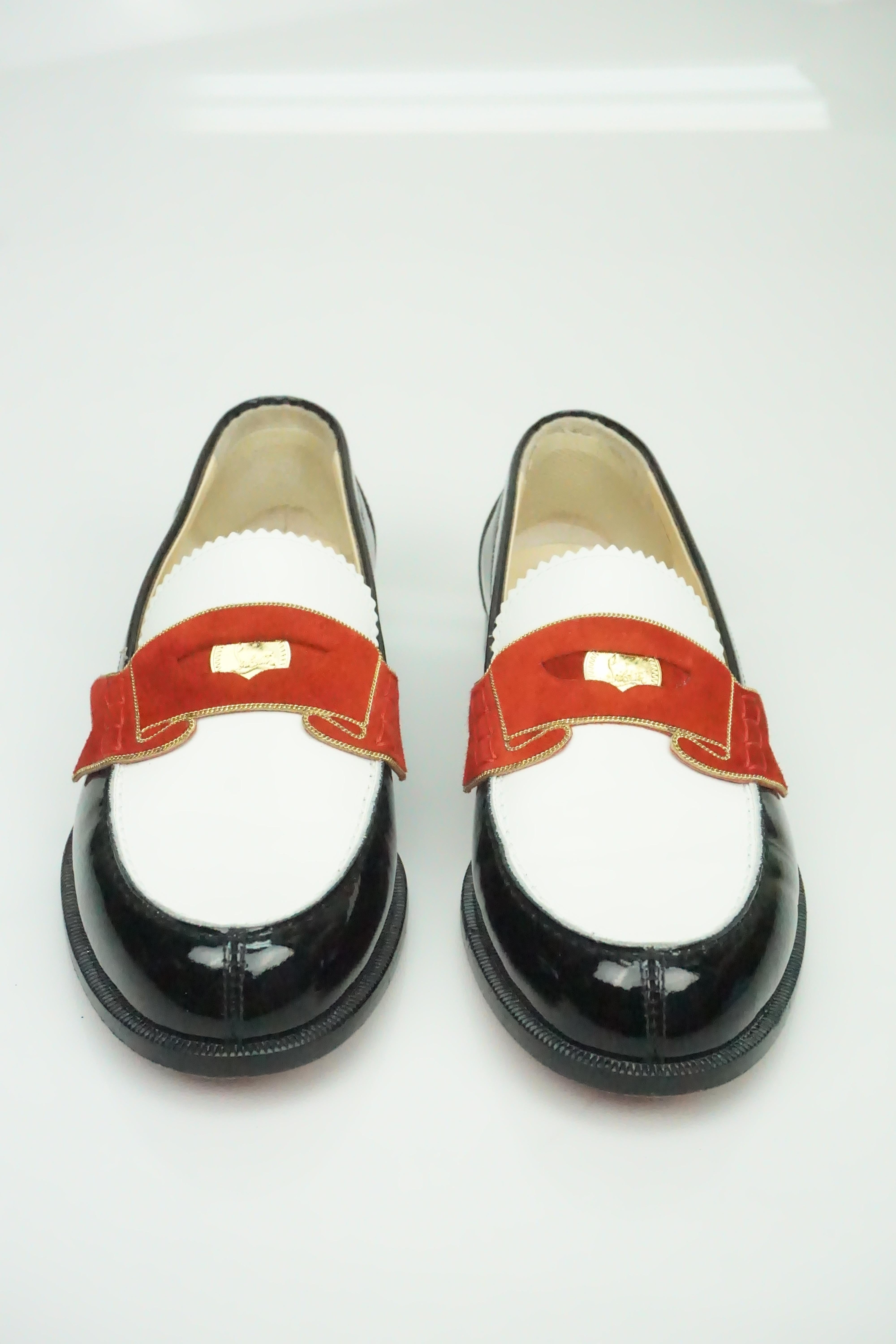 Christian Louboutin Monnono Patent Penny Loafer - 36  These uniquely beautiful shoes are in good condition. The black part of the show is completely made of patent leather. The red trimming on the front of the shoe is made of a suede material and